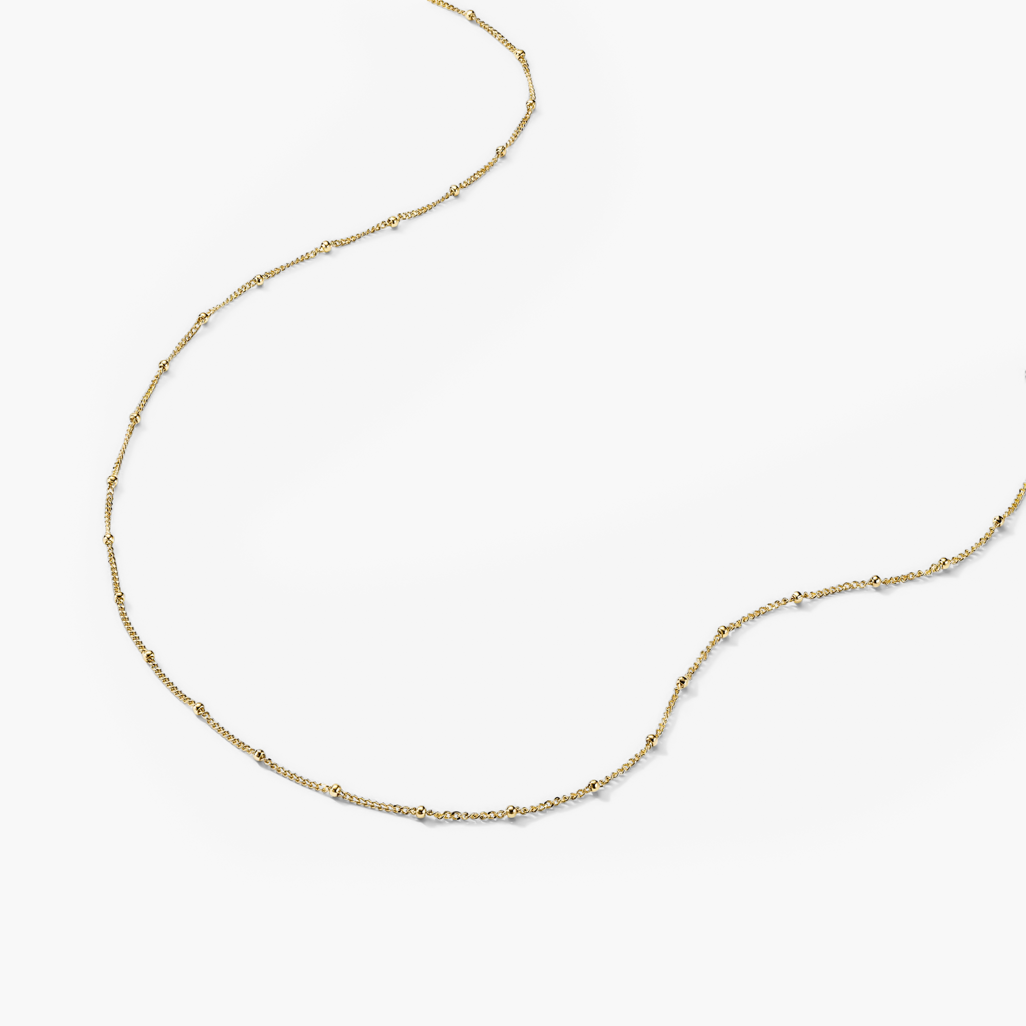 Spheres Chain Necklace: Minimal gold chain with spherical beads, versatile for any occasion.