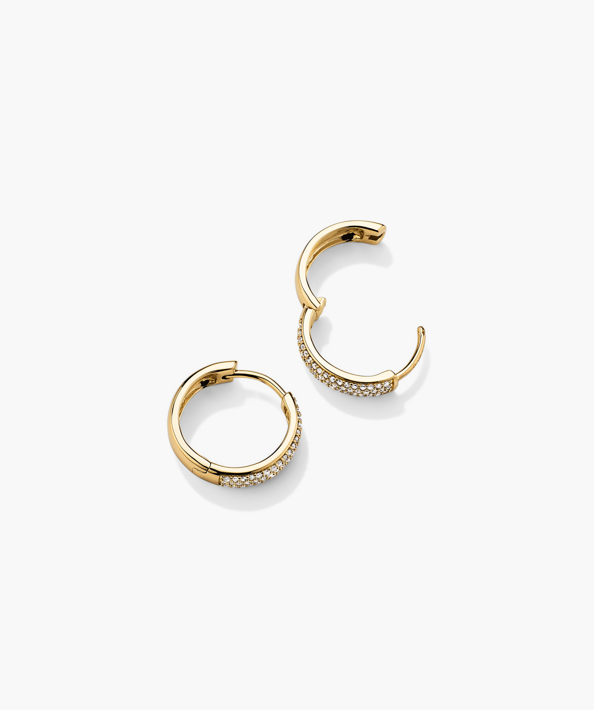 Bold PavÃ© Diamond Small Hoops: A pair of handcrafted 14k gold hoop earrings adorned with responsibly sourced diamonds.