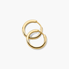 Tube Medium Hoops: A pair of modern gold hoop earrings with a bold, tubular design and clicker closure for comfort and security.