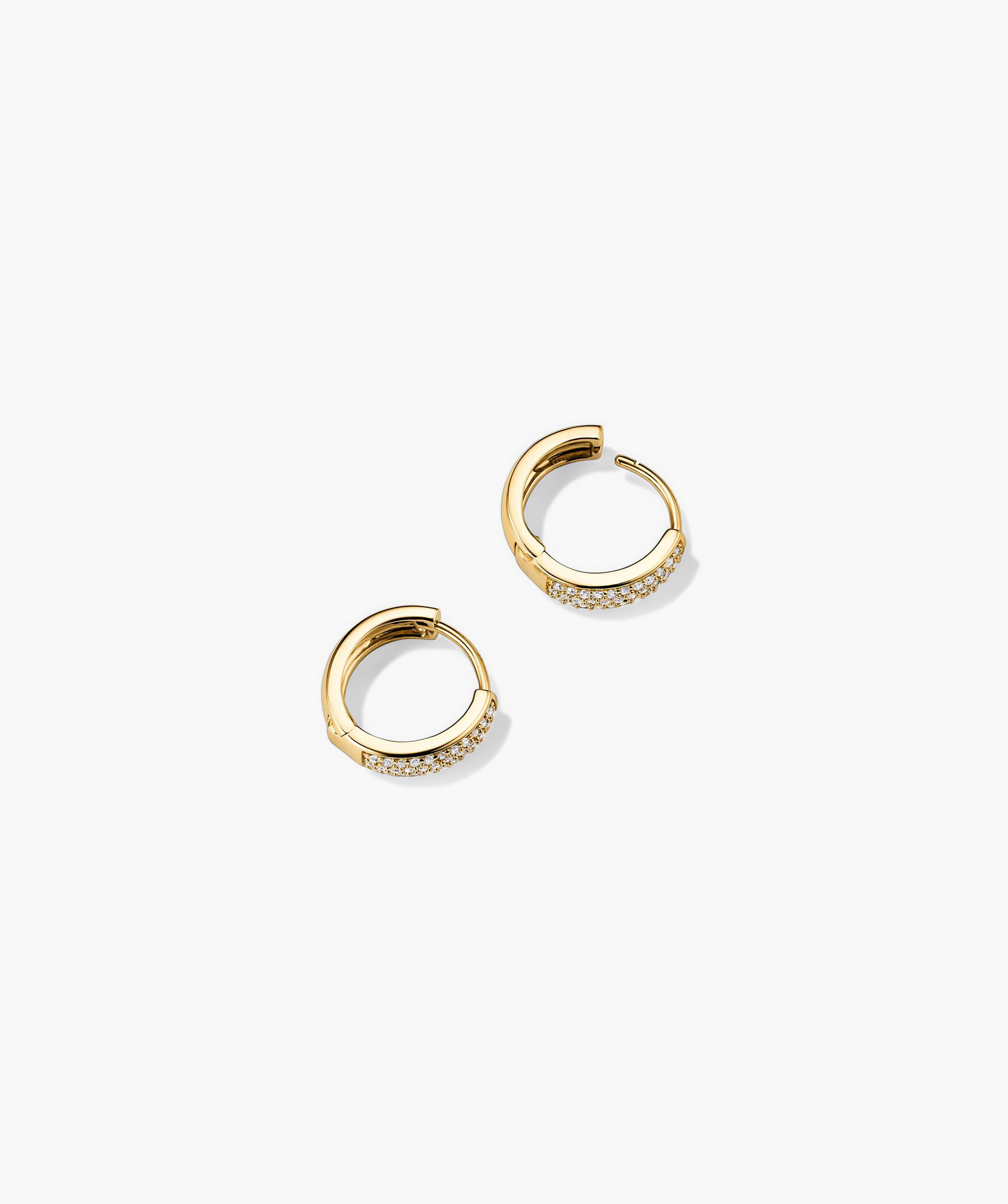 Bold PavÃ© Diamond Huggie Hoops: A pair of 14k solid gold hoop earrings featuring pavÃ©-set, responsibly sourced diamonds, handcrafted for a sparkling, elegant look.