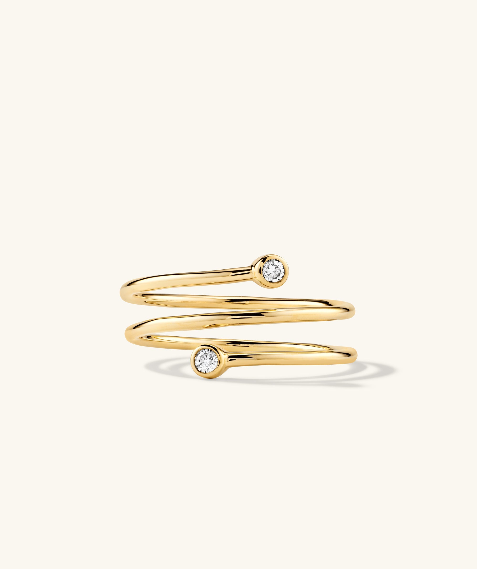 Diamond Coil Ring: 14k gold ring with pavÃ© diamonds, giving the appearance of multiple rings in one. Handcrafted and featuring responsibly sourced gemstones.
