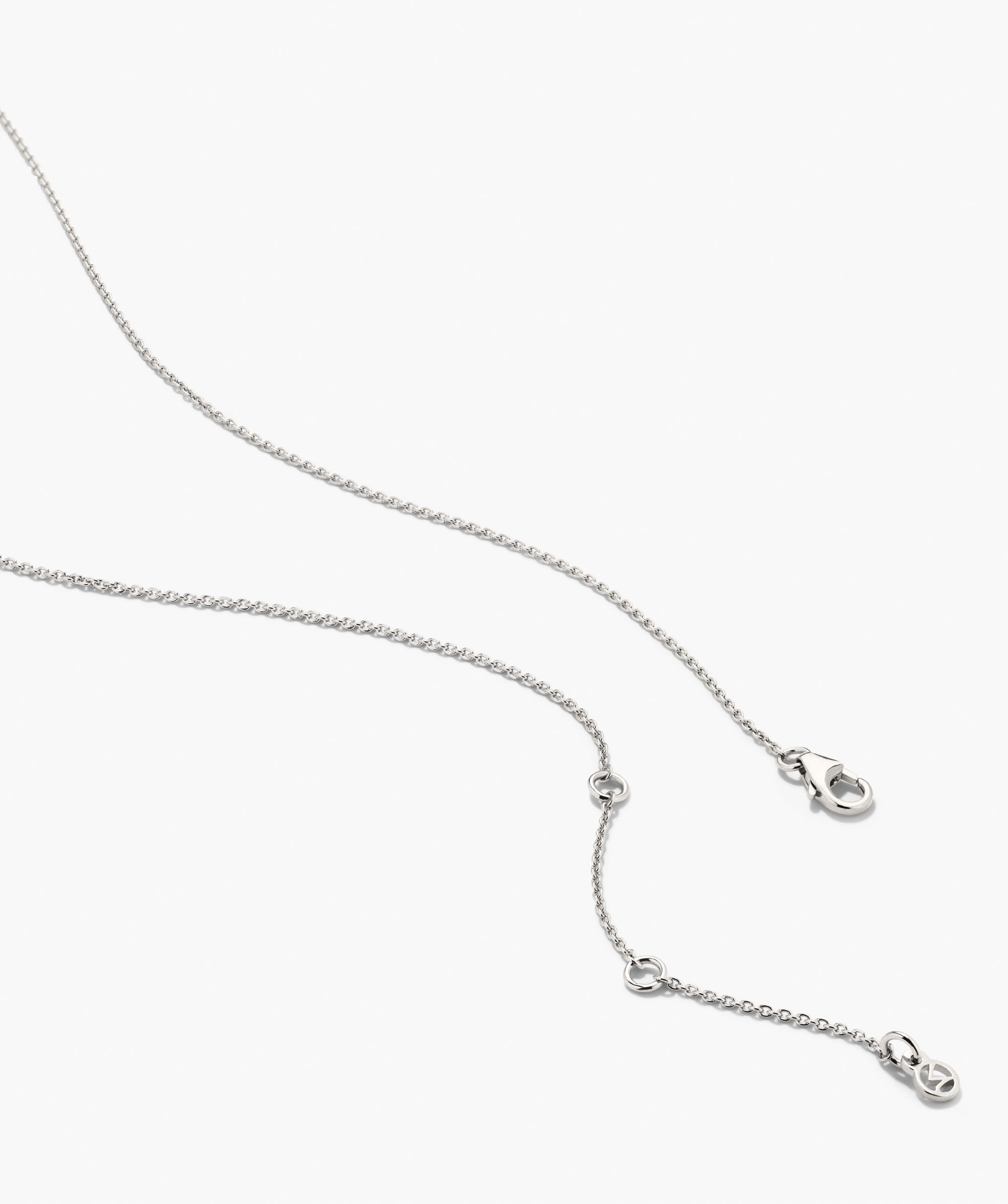 Floating Lab Grown Sapphire Necklace features a delicate silver-tone chain with fine interlocking links, adjustable length, and a tiny circular charm.