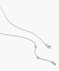 Floating Lab Grown Sapphire Necklace features a delicate silver-tone chain with fine interlocking links, adjustable length, and a tiny circular charm.