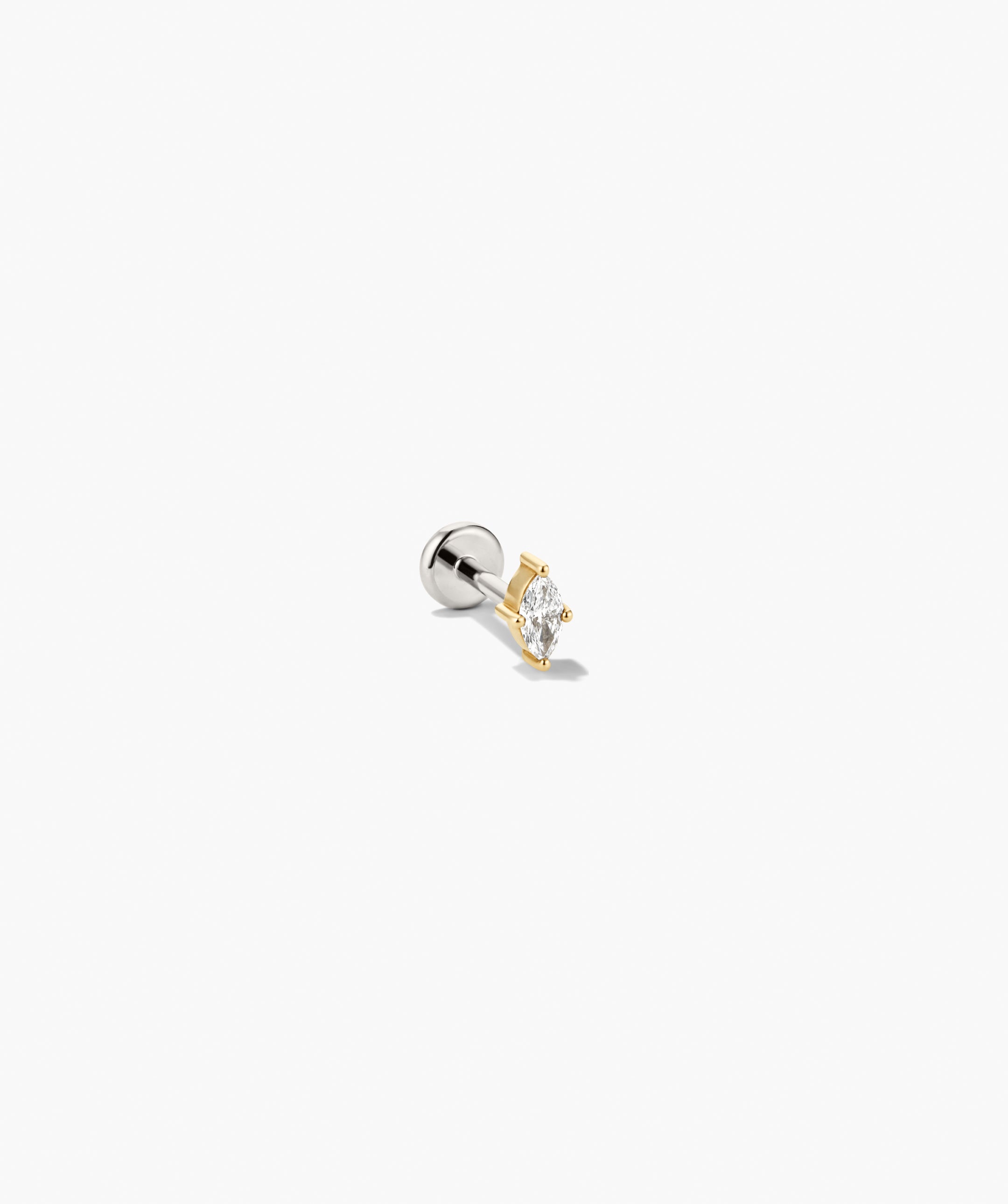 Piercing Studio - Lab Grown Diamond Marquise Studs featuring a marquise-cut clear stone in a yellow-gold setting with a silvery rounded backing.