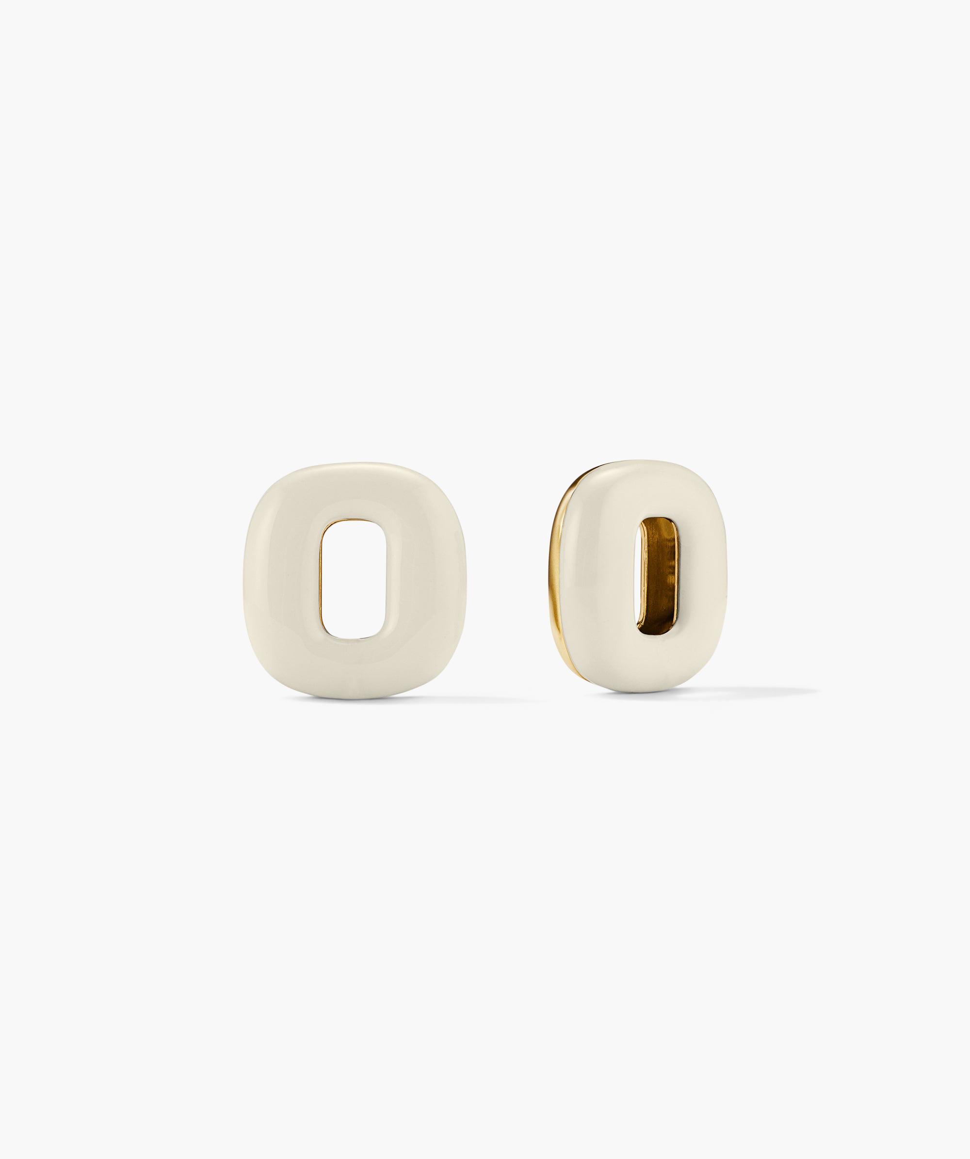 Stevie Hoop Links: A minimalist white and gold circular link with a central hole, designed to be interchangeable and reversible for versatile styling with Stevie Hoops.