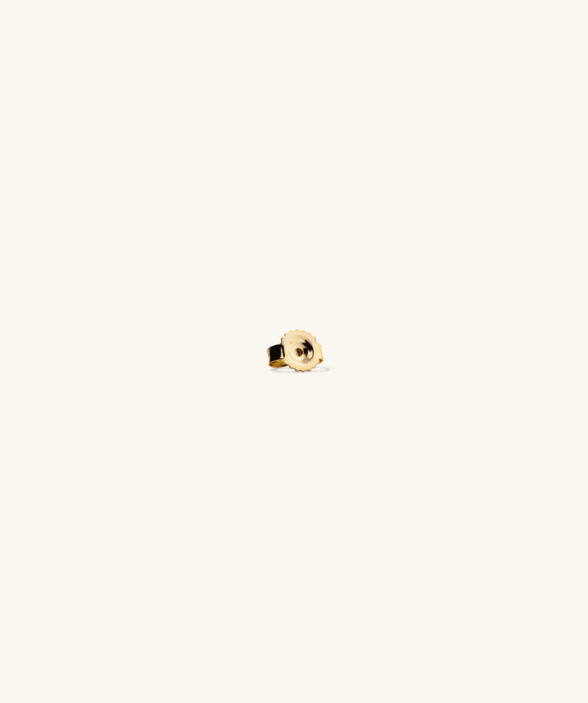Close-up of the Mini Lotus Diamond Stud, a 14k solid gold ring with a lotus-shaped diamond, perfect for stacking.