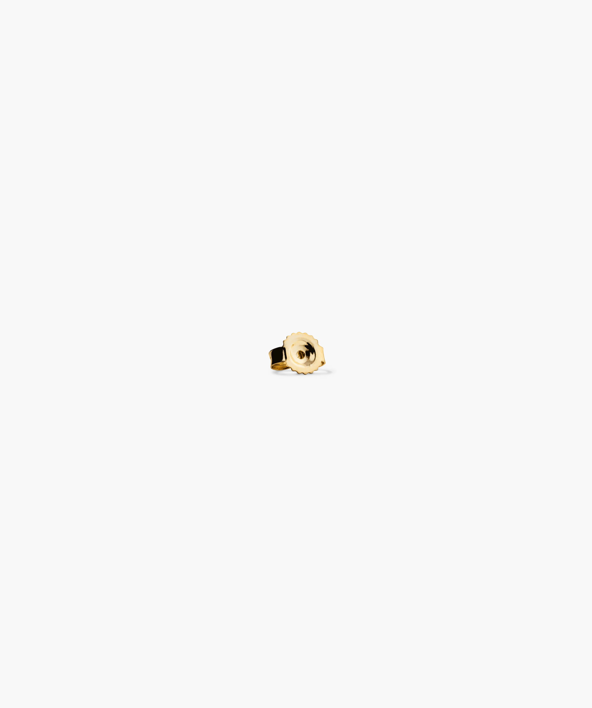 Close-up of the Mini Lotus Diamond Stud, a 14k solid gold ring with a lotus-shaped diamond, perfect for stacking.
