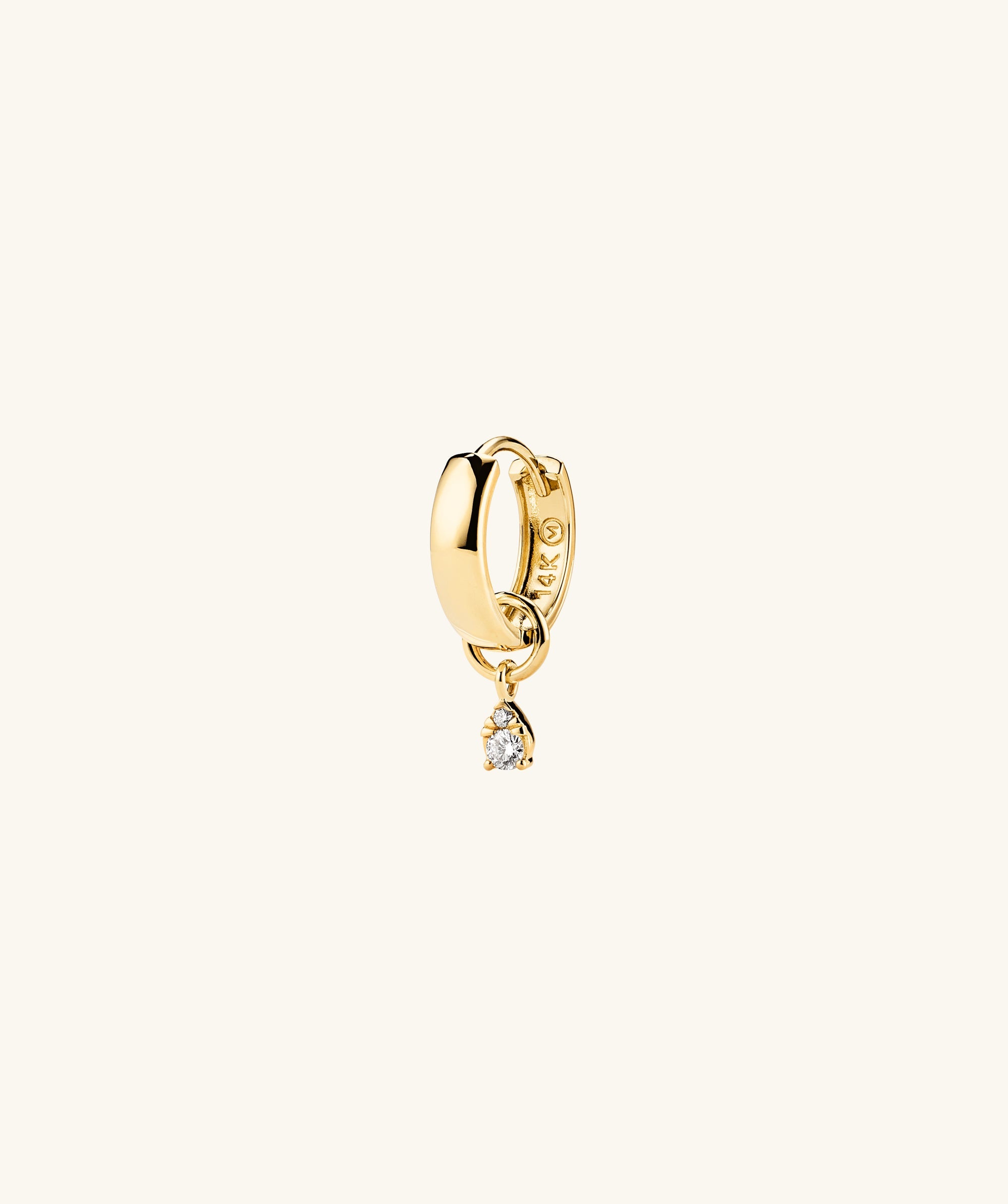Mini Pear Diamond Hoop Charm: A close-up of a 14k gold earring featuring a pear-shaped diamond, perfect for stacking or completing your look.