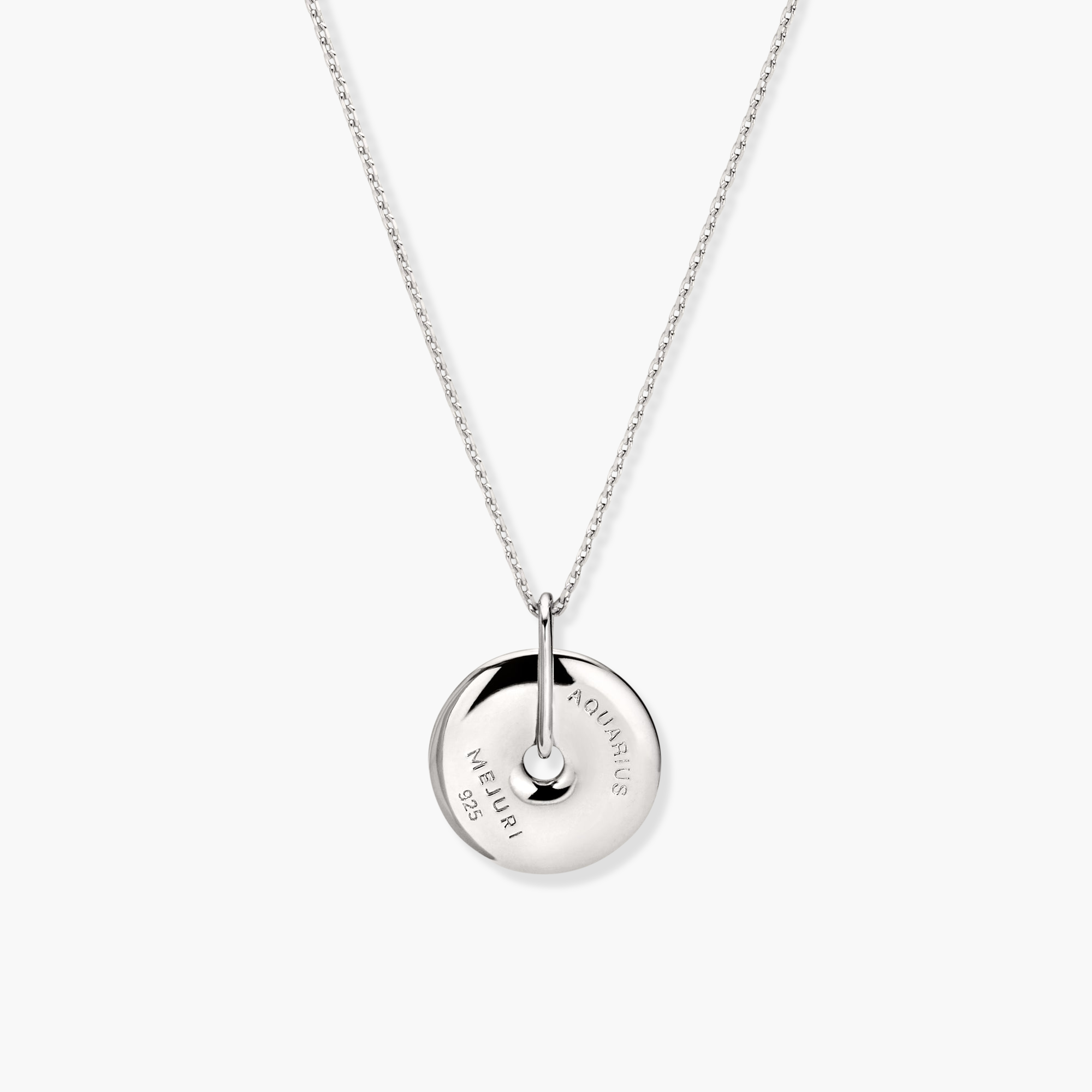 Zodiac Pendant Necklace: A silver necklace featuring an elevated, spinning disc pendant adorned with white sapphire gemstones, subtly showcasing a constellation design.