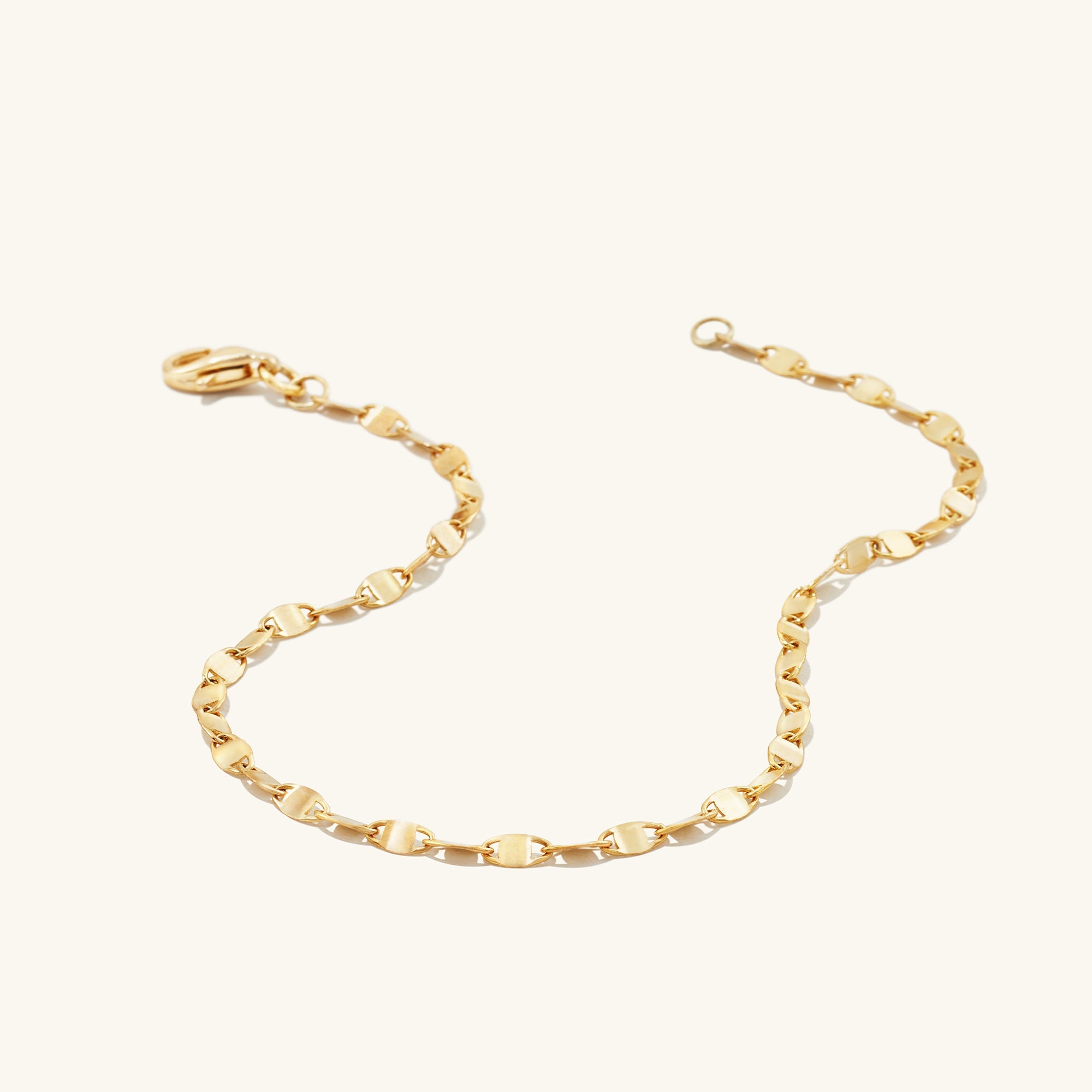 Anchor Chain Anklet: A handcrafted 14k solid gold chain with interconnected links, resembling a shipâs anchor chain. Minimalist design, maximum styling impact.