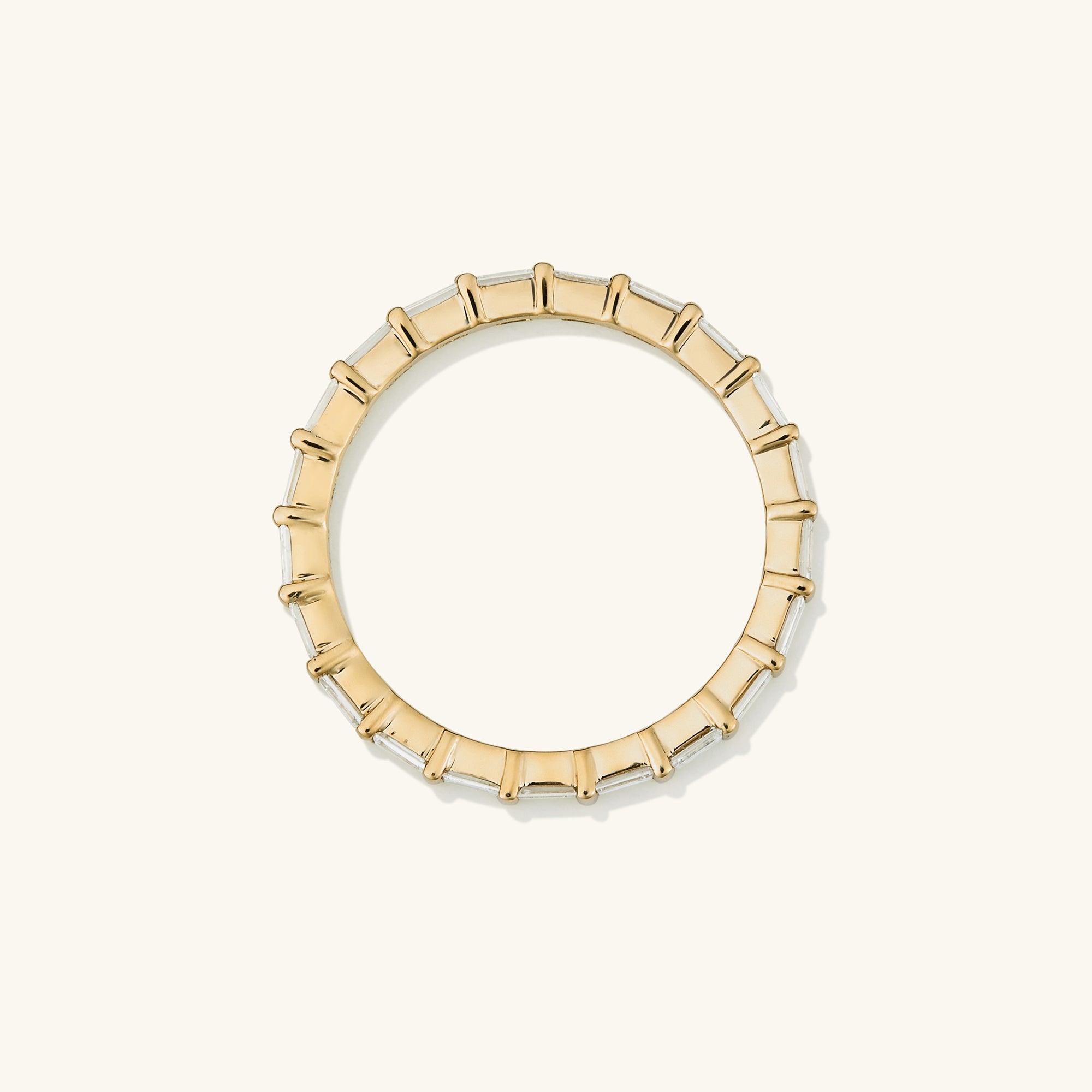 Baguette Diamond Eternity Band: A 14k solid gold ring adorned with Kimberley Process-certified baguette diamonds, showcasing timeless elegance and intricate craftsmanship.