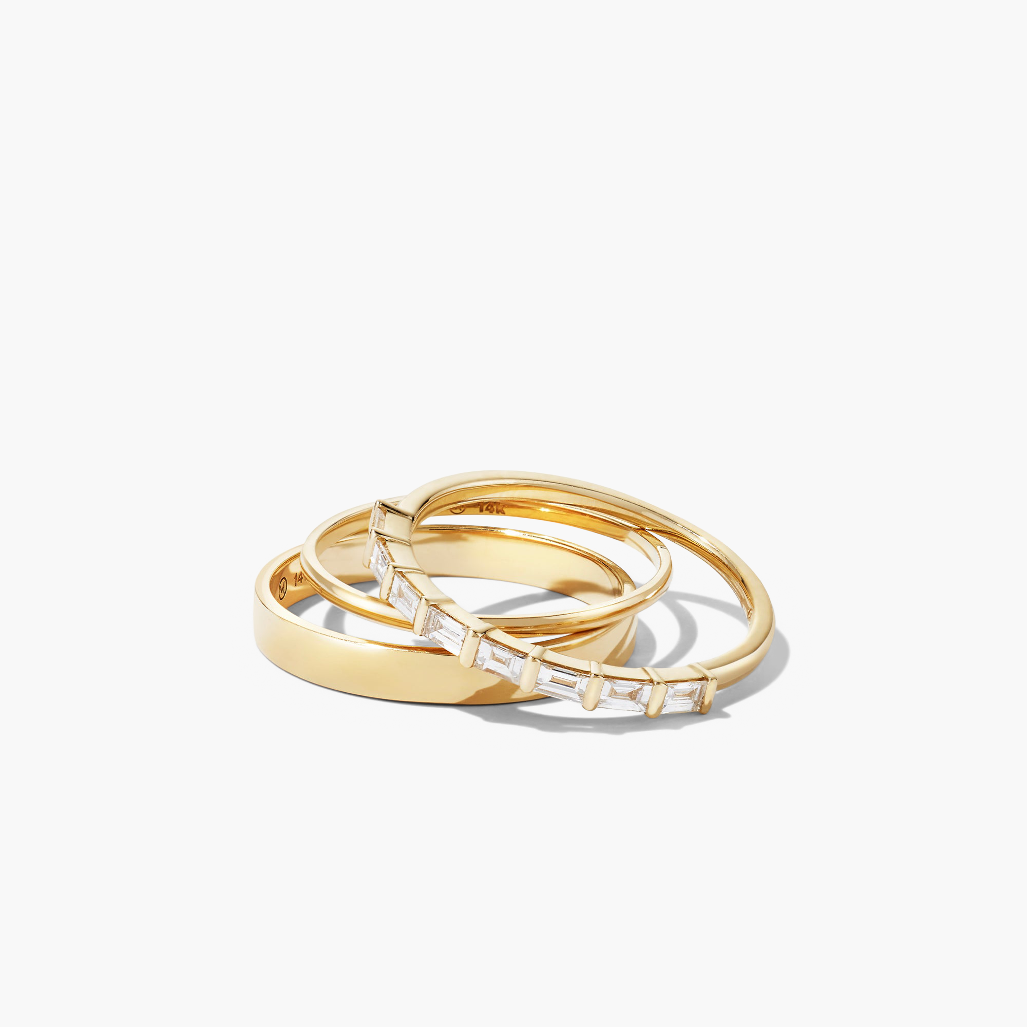 Baguette Diamond Half Eternity Band with eight baguette diamonds set in a timeless gold and silver stack.