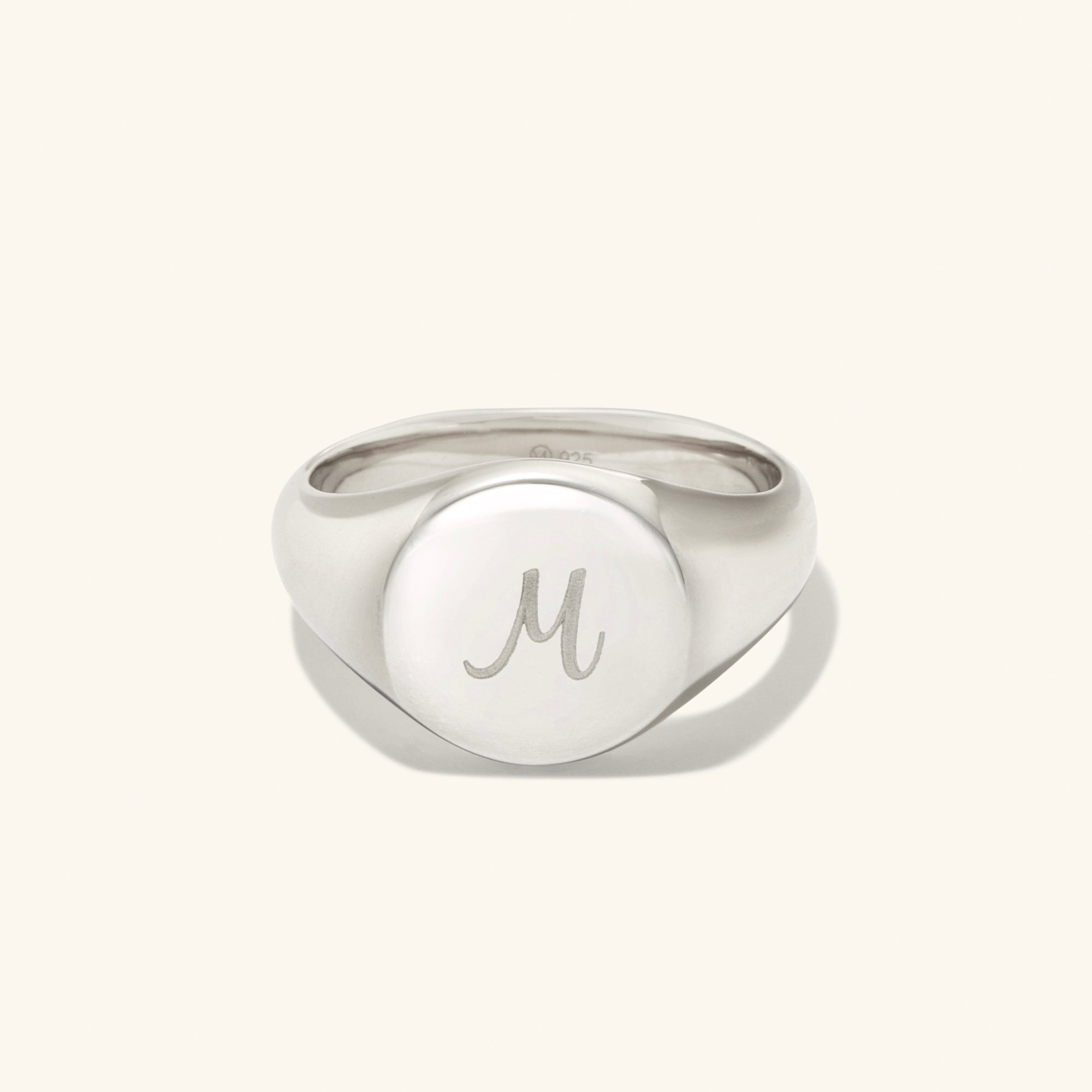 Bold Round Signet Ring in sterling silver with an engraved letter, showcasing a sleek, handcrafted design.