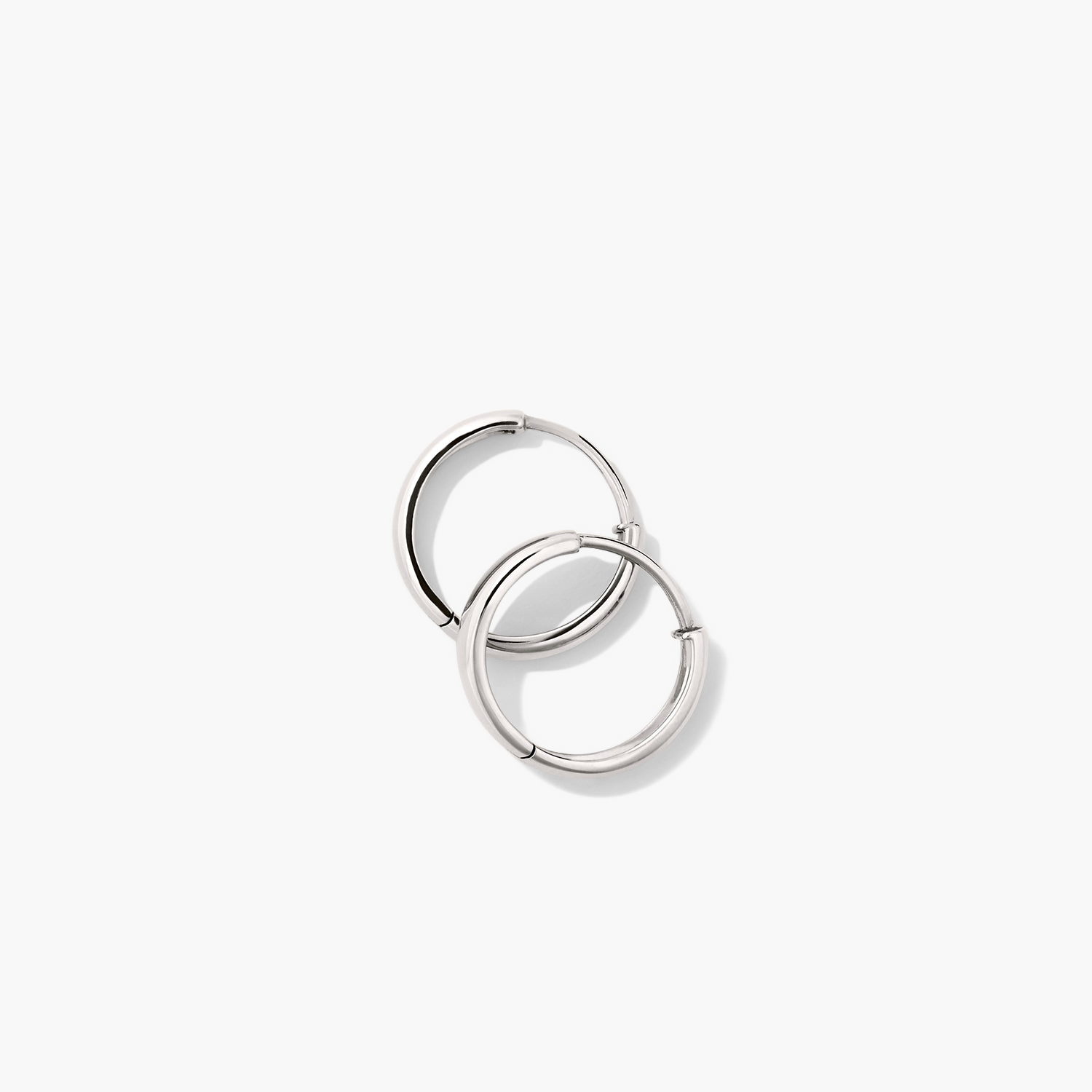 Bold Small Hoops: Pair of silver hoop earrings, perfect for elevating any outfit with a touch of elegance.