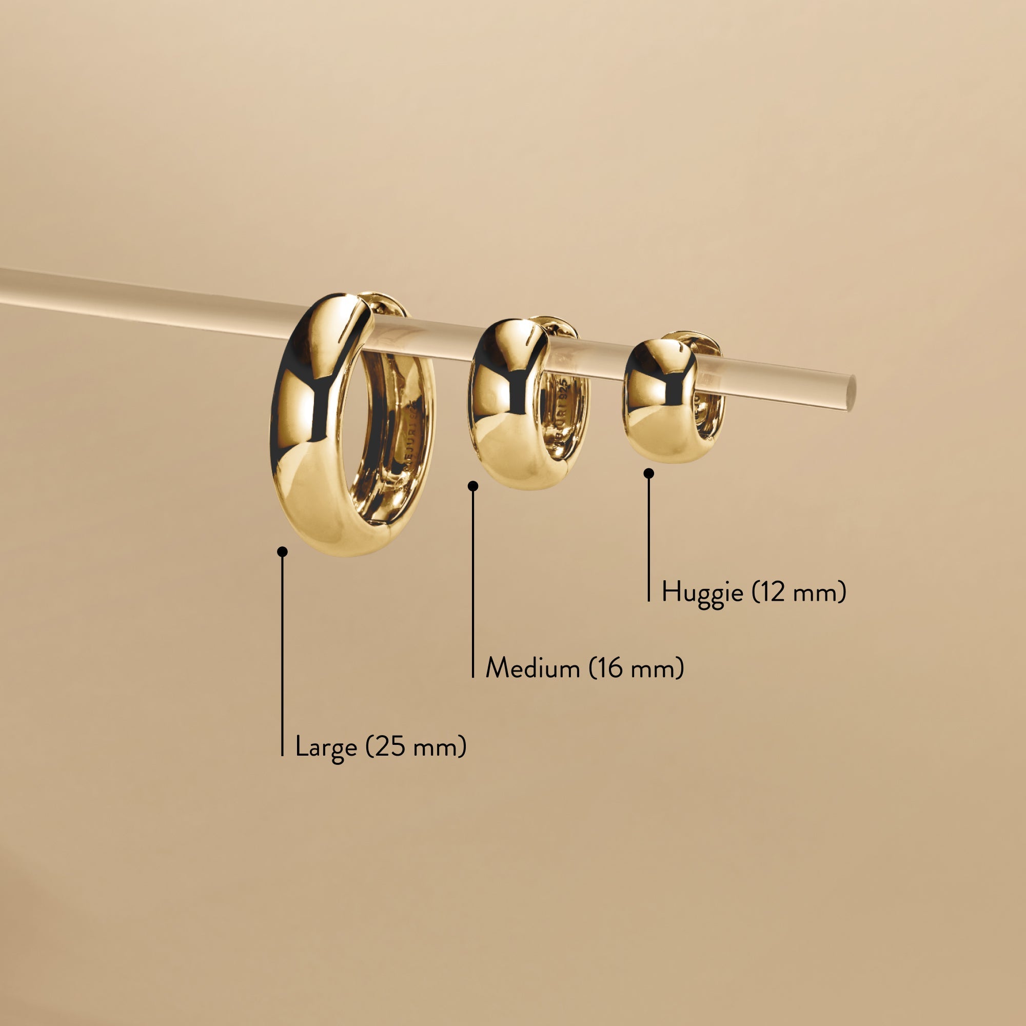 Chunky Huggie Hoops with clicker closure for comfort, shown with size measurements. Close-up displays their pillowy design and secure fit.