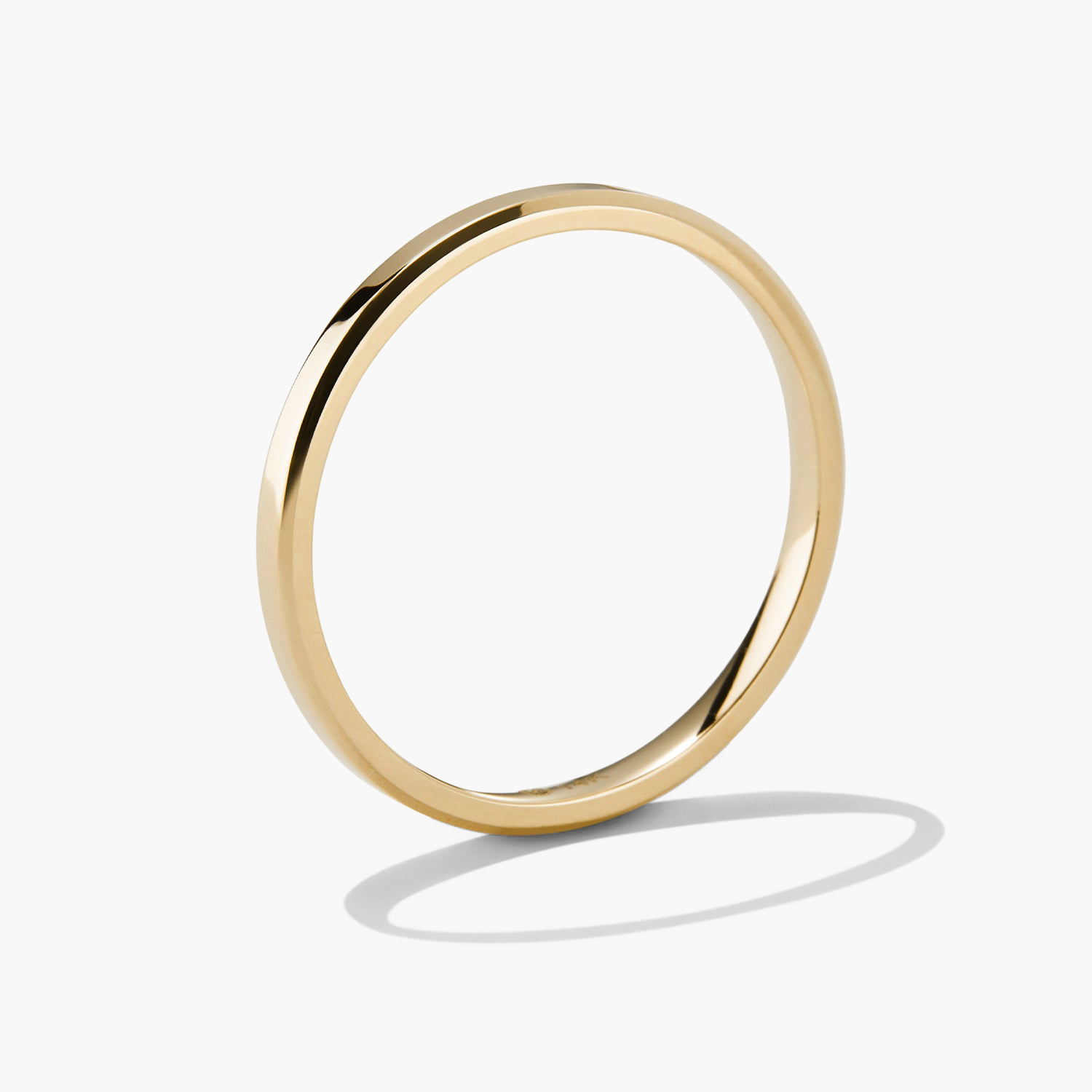 Gold 2mm Smooth Band, handcrafted in 14k solid gold with streamlined edges, ideal for symbolizing unbreakable bonds or stacking in a ring collection.