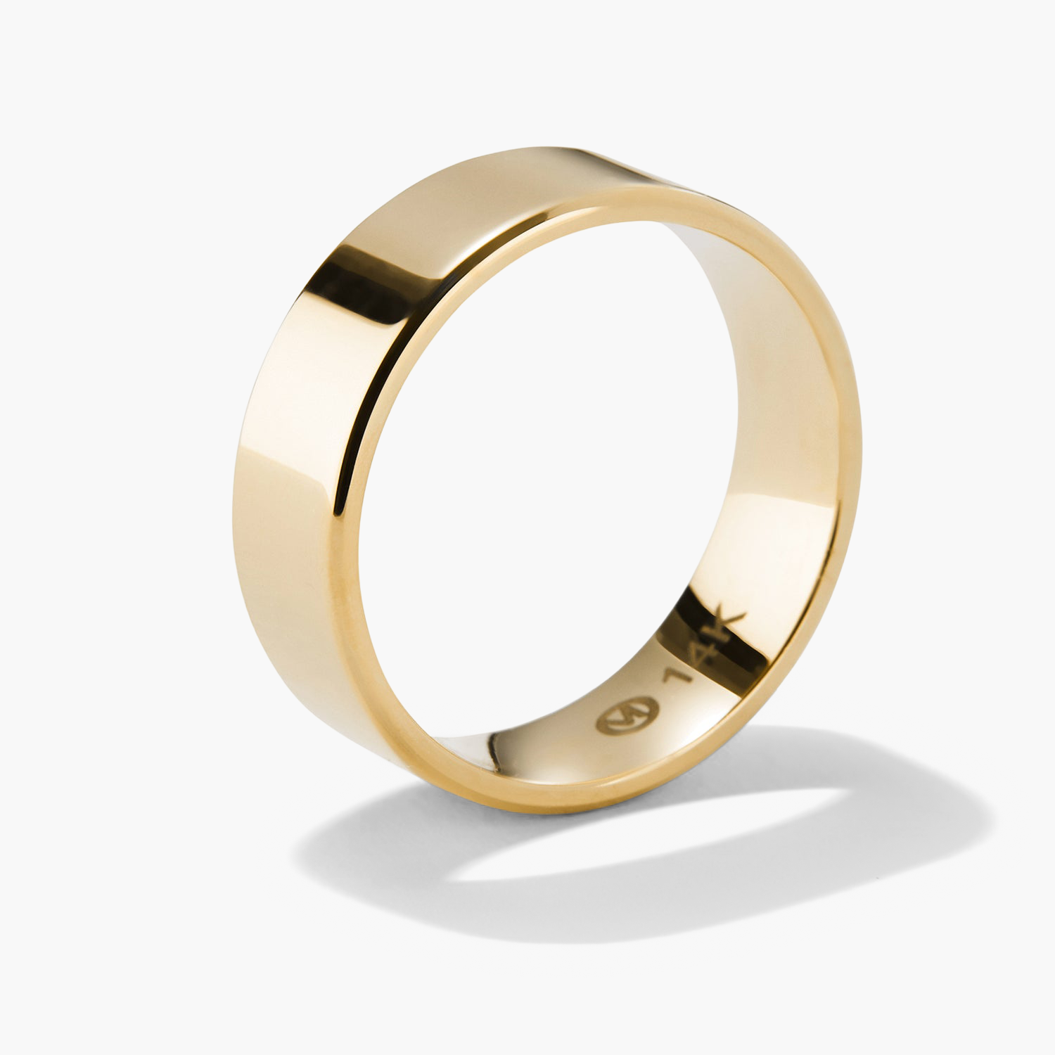 6mm Smooth Band: A gold ring with a sleek, smooth finish, designed for lasting wear. Perfect for marking significant milestones.