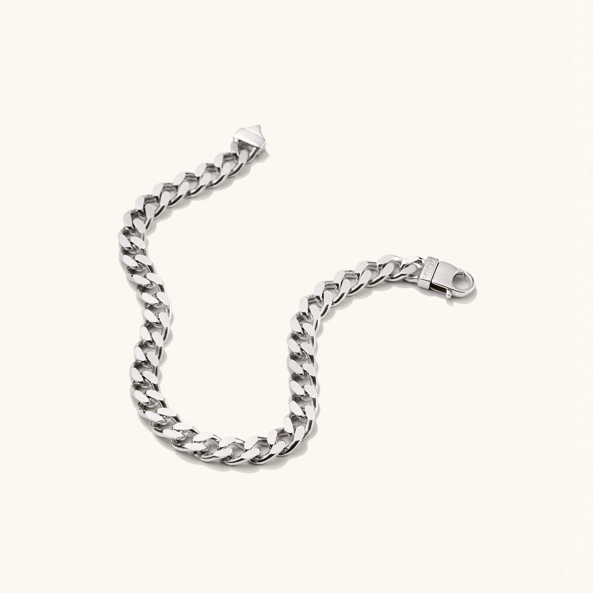 Curb Chain Bracelet: A silver chain bracelet with a sleek, stylish design, perfect for everyday wear. Ideal for solo or layered looks, making a bold statement.