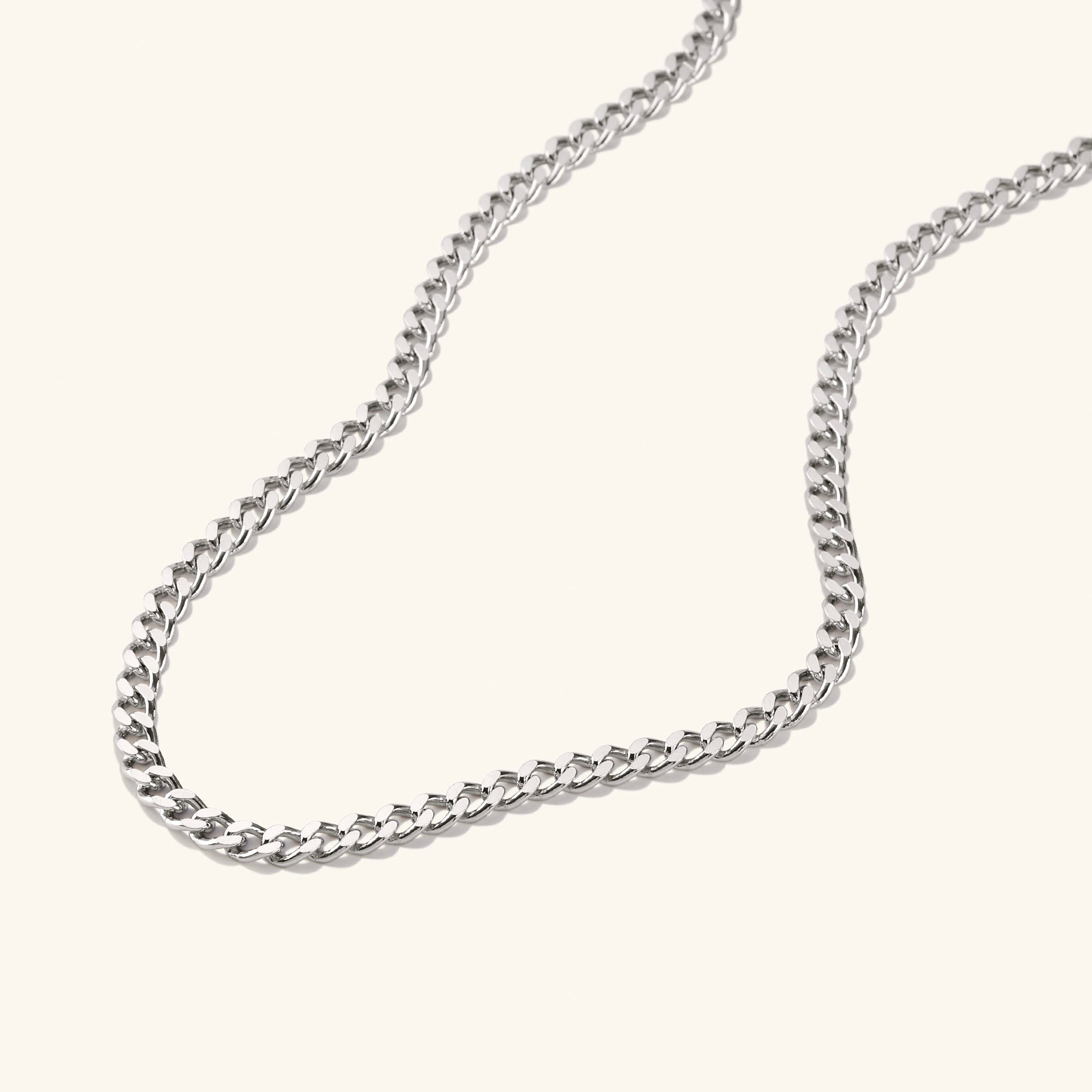 5mm Curb Chain Necklace: A close-up of a silver chain necklace, showcasing its classic and versatile design, ideal for everyday wear.