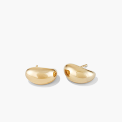 DÃ´me Huggies: Sleek, sculptural gold earrings with a rounded vault, part of Mejuri's iconic collection, perfect for stacking and everyday wear.