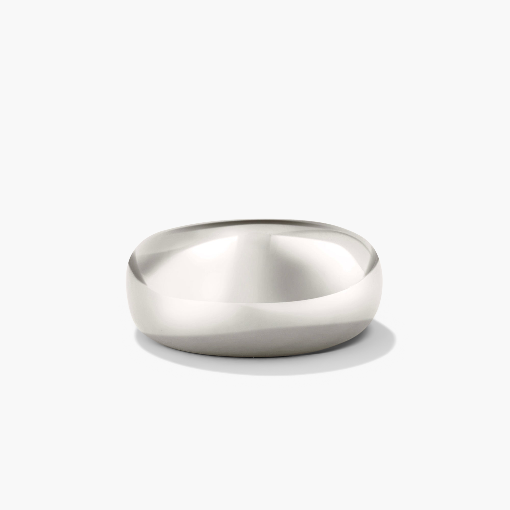Silver DÃ´me Ring with a bold, classic design, ideal for stacking with smaller rings to create a stylish, layered look.
