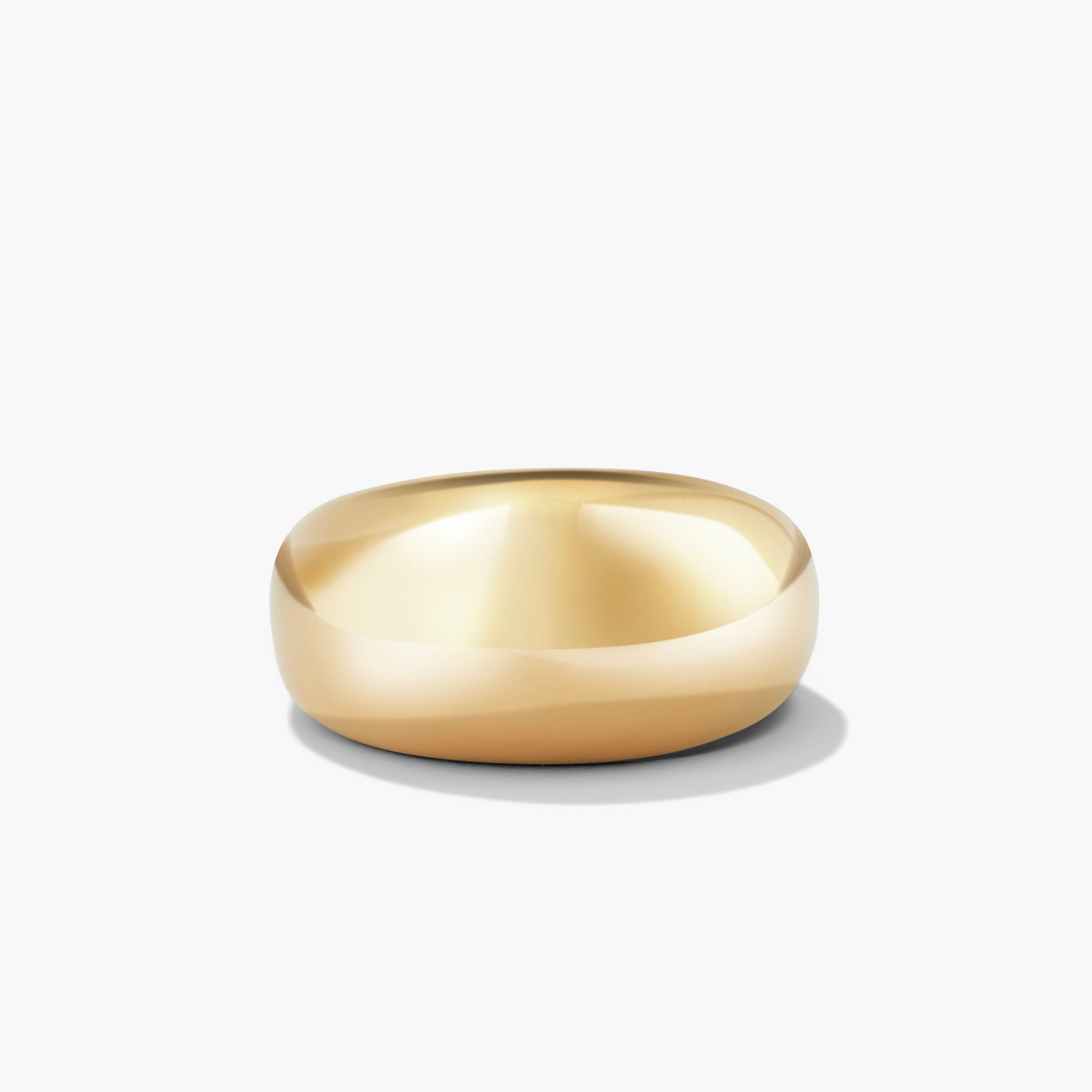 DÃ´me Ring: A classic gold ring with a bold design, perfect for stacking with daintier rings.