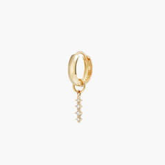 Gold hoop earring with a small diamond drop, known as Single Diamond Icicle Hoop Charm, ideal for personalizing your eardrobe with a chic, versatile look.