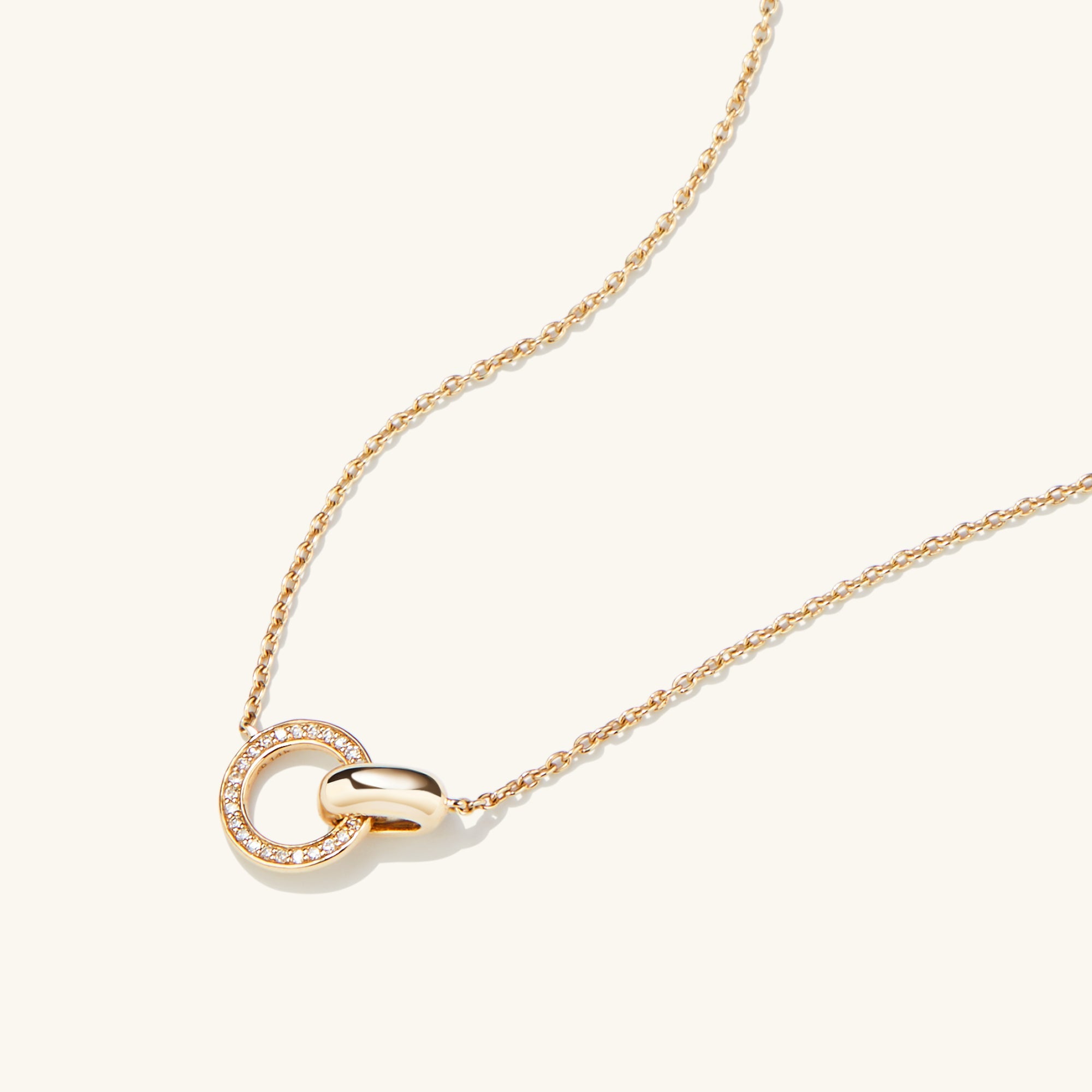 PavÃ© Diamond Linked Necklace featuring two interlinked rings, handcrafted in 14k gold with Kimberley Process compliant diamonds.