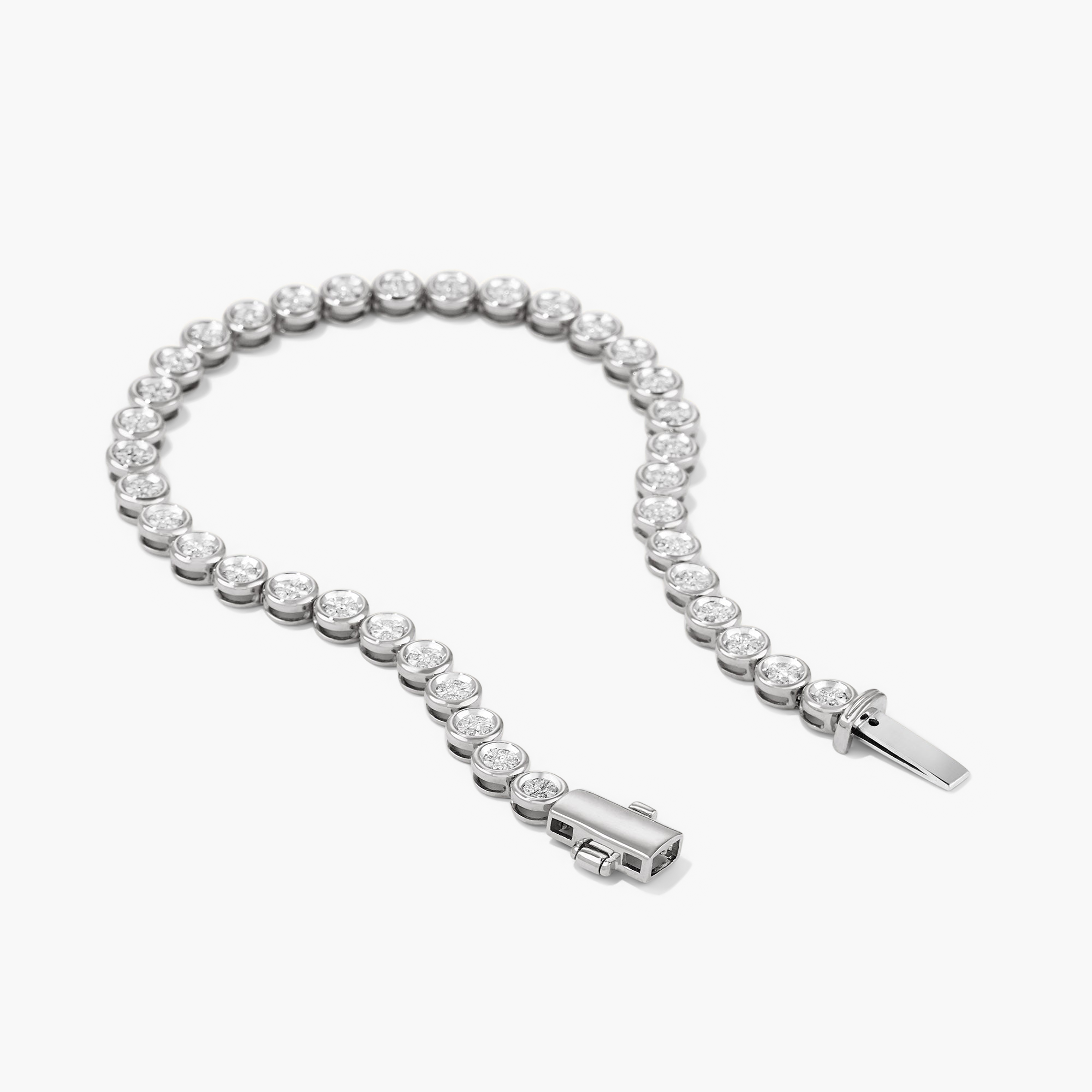 Micro-PavÃ© Diamond RiviÃ¨re Bracelet in silver, showcasing 176 hand-set diamonds in knife edge bezel for a continuous stream of shine.