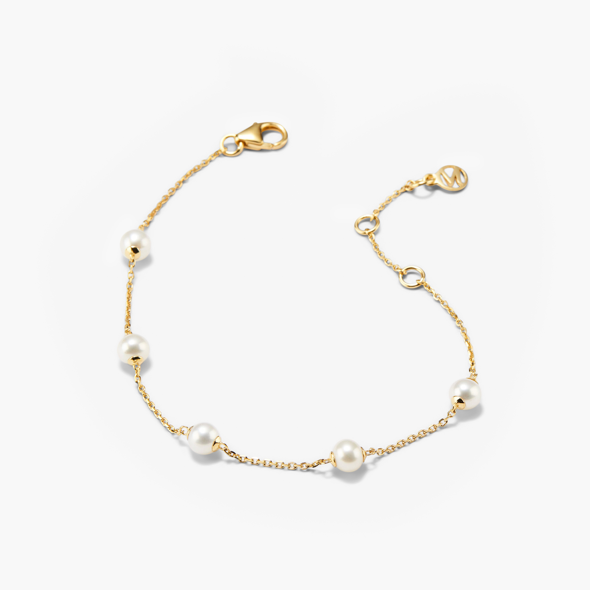Mini Pearl Satellite Bracelet featuring a gold vermeil chain adorned with evenly spaced freshwater pearls, offering a versatile and elegant fashion accessory.