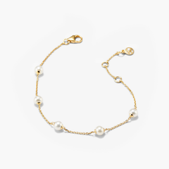 Mini Pearl Satellite Bracelet featuring a gold vermeil chain adorned with evenly spaced freshwater pearls, offering a versatile and elegant fashion accessory.