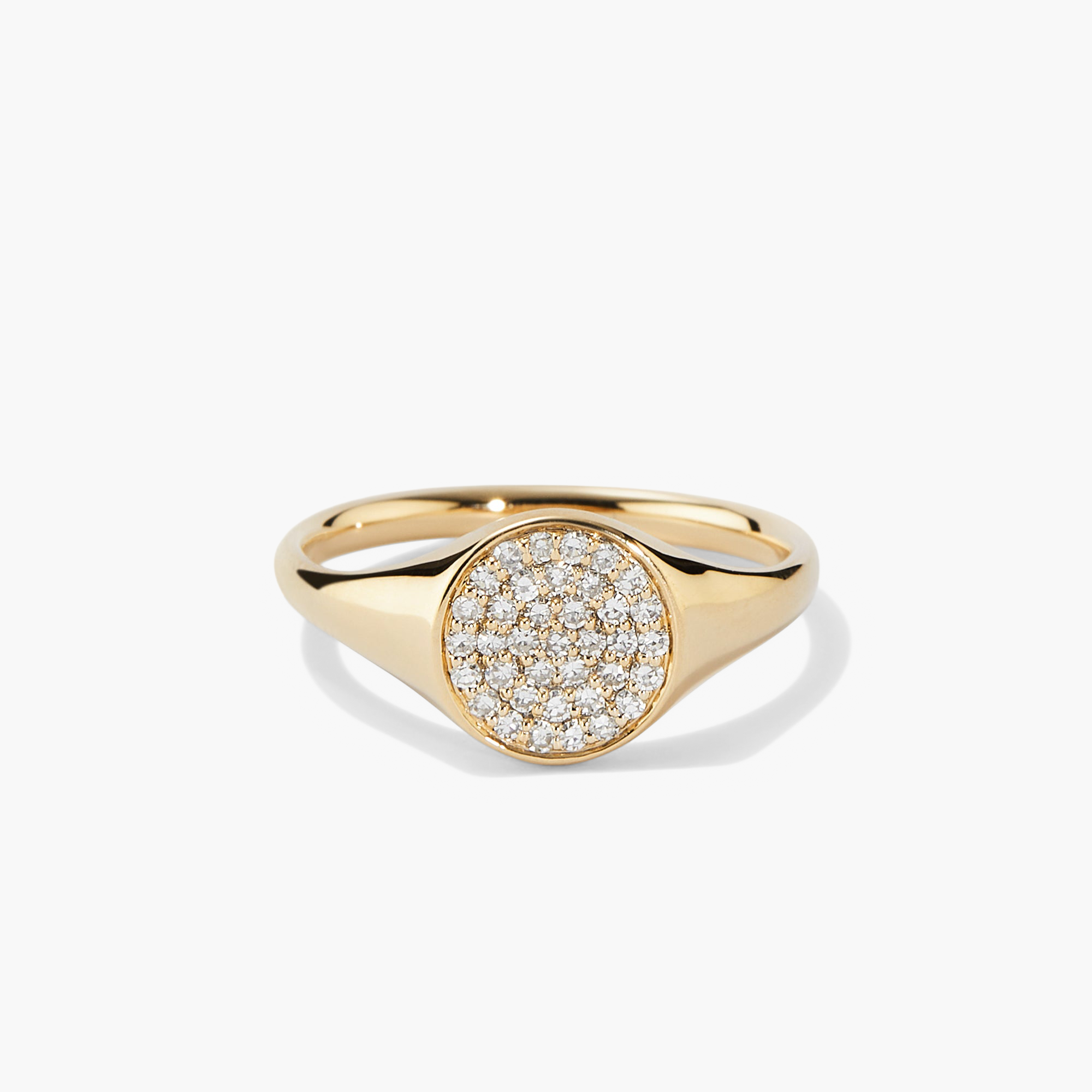 PavÃ© Diamond Signet Pinky Ring featuring a gold band with a central diamond setting, embodying elegance and sophistication in a compact design.