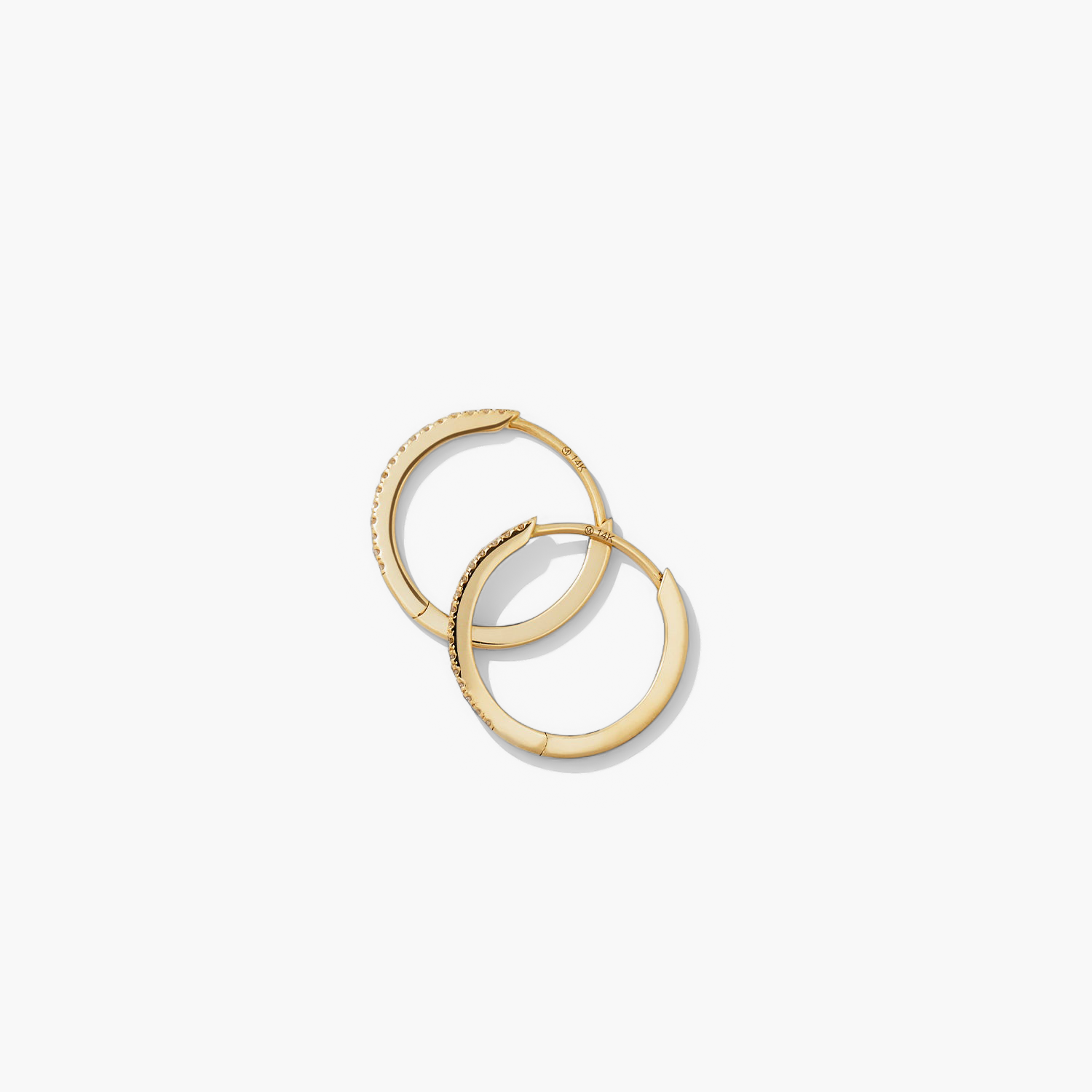 PavÃ© Diamond Small Hoops: Handcrafted 14k solid gold earrings, featuring pavÃ© diamonds on one side and a sleek finish on the other, versatile for any look.