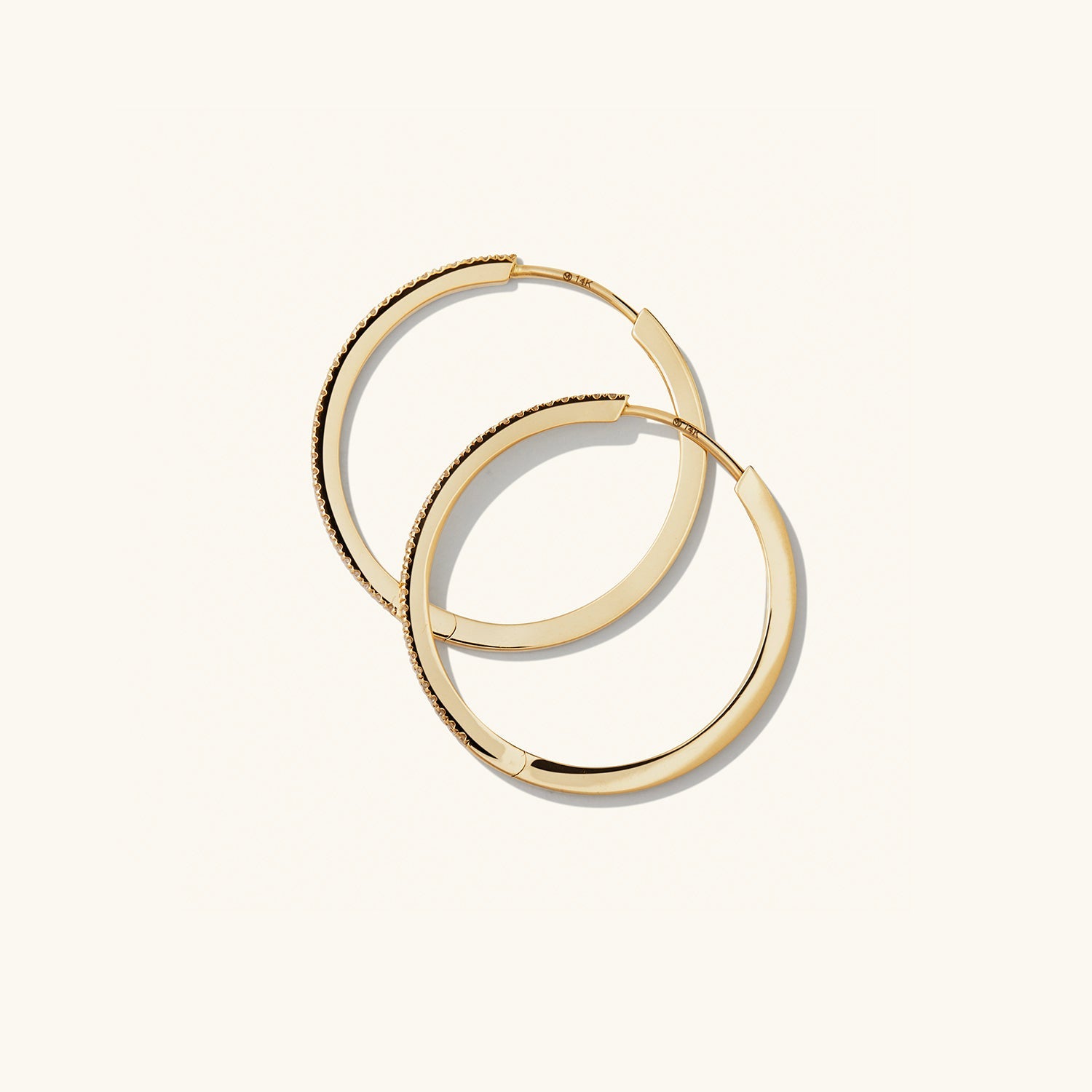 PavÃ© Diamond Large Hoops: Handcrafted 14k solid gold hoop earrings with pavÃ© diamonds, designed for versatile wear. Perfect for elevating any outfit.