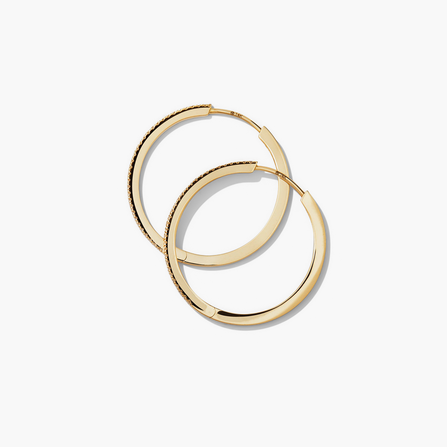 PavÃ© Diamond Large Hoops: Handcrafted 14k solid gold hoop earrings with pavÃ© diamonds, designed for versatile wear. Perfect for elevating any outfit.