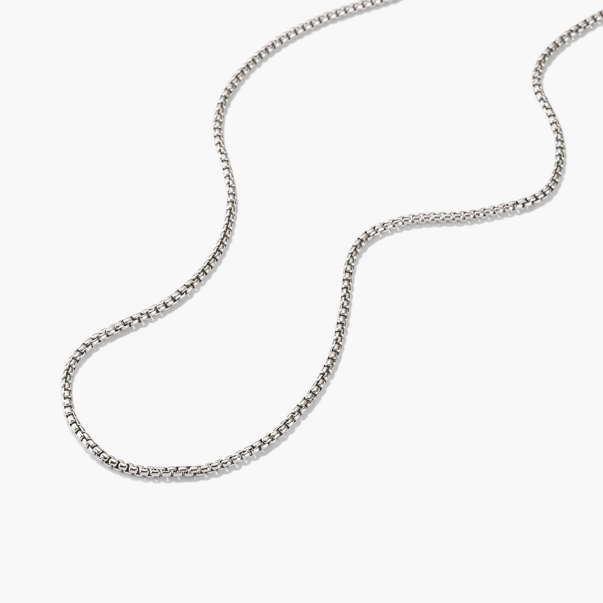 Round Box Chain Necklace displayed on a white surface, featuring a sleek, understated silver chain perfect for everyday wear.