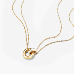 Vermeil Linked Necklace featuring two interlinked rings on a gold chain, symbolizing personal connections. Handcrafted in 18k gold over 925 sterling silver.