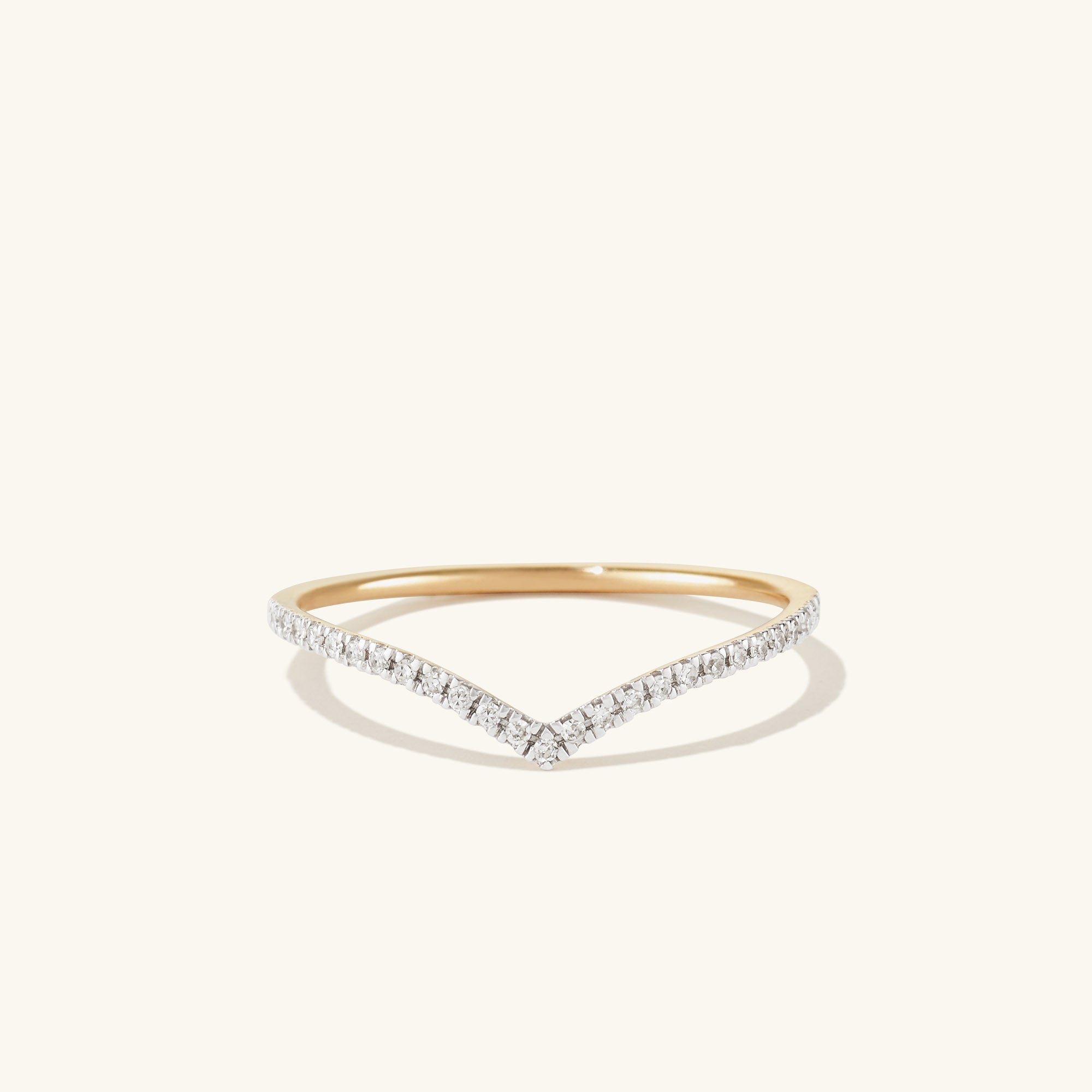 PavÃ© Diamond Wishbone Ring: 14k gold ring adorned with pavÃ© diamonds, forming a delicate wishbone shape.