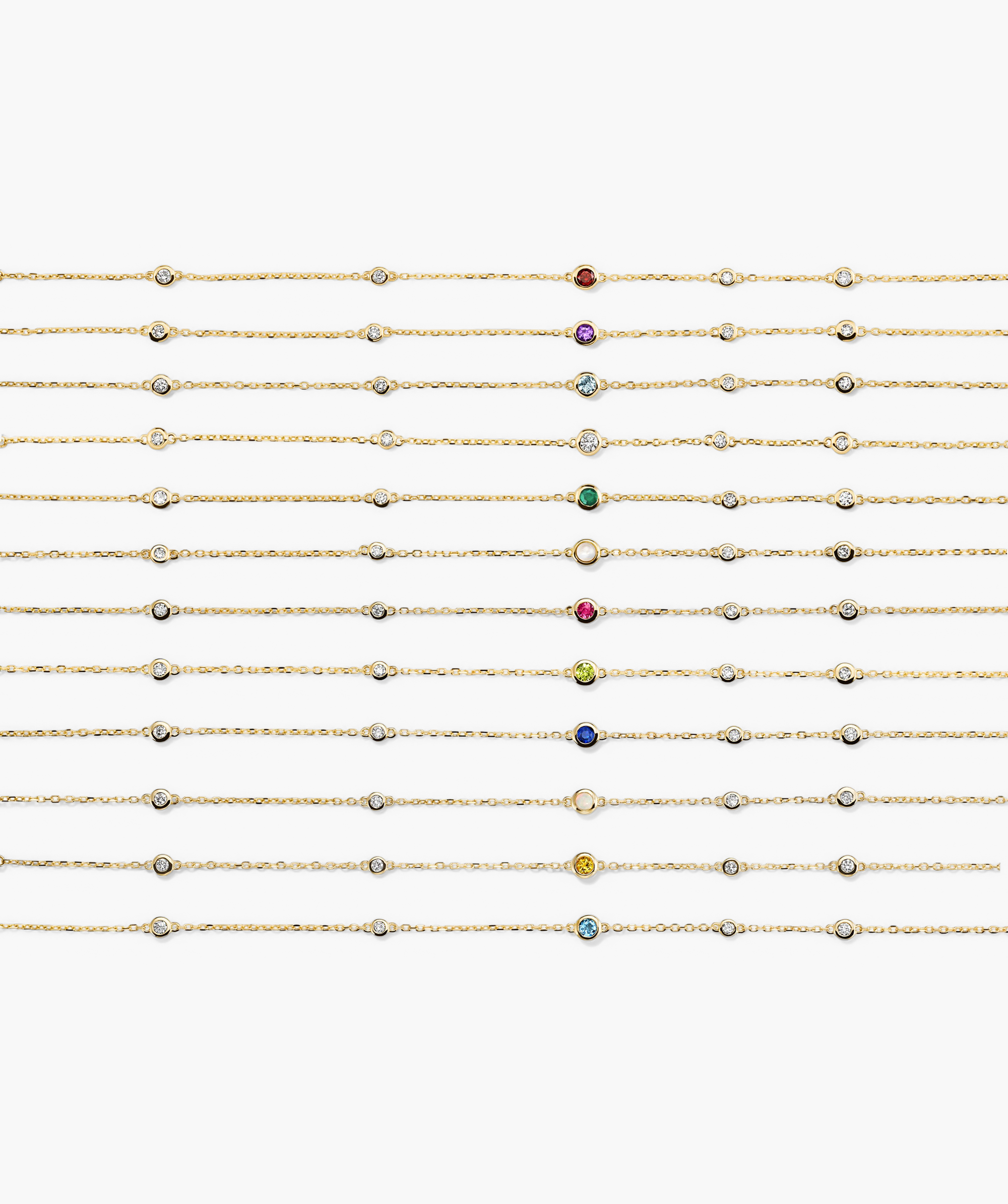 Multi Gemstone Station Bracelet featuring bezel-set diamonds and a colored gemstone centerpiece, representing a birthstone collection. Perfect for stacking with elegance.