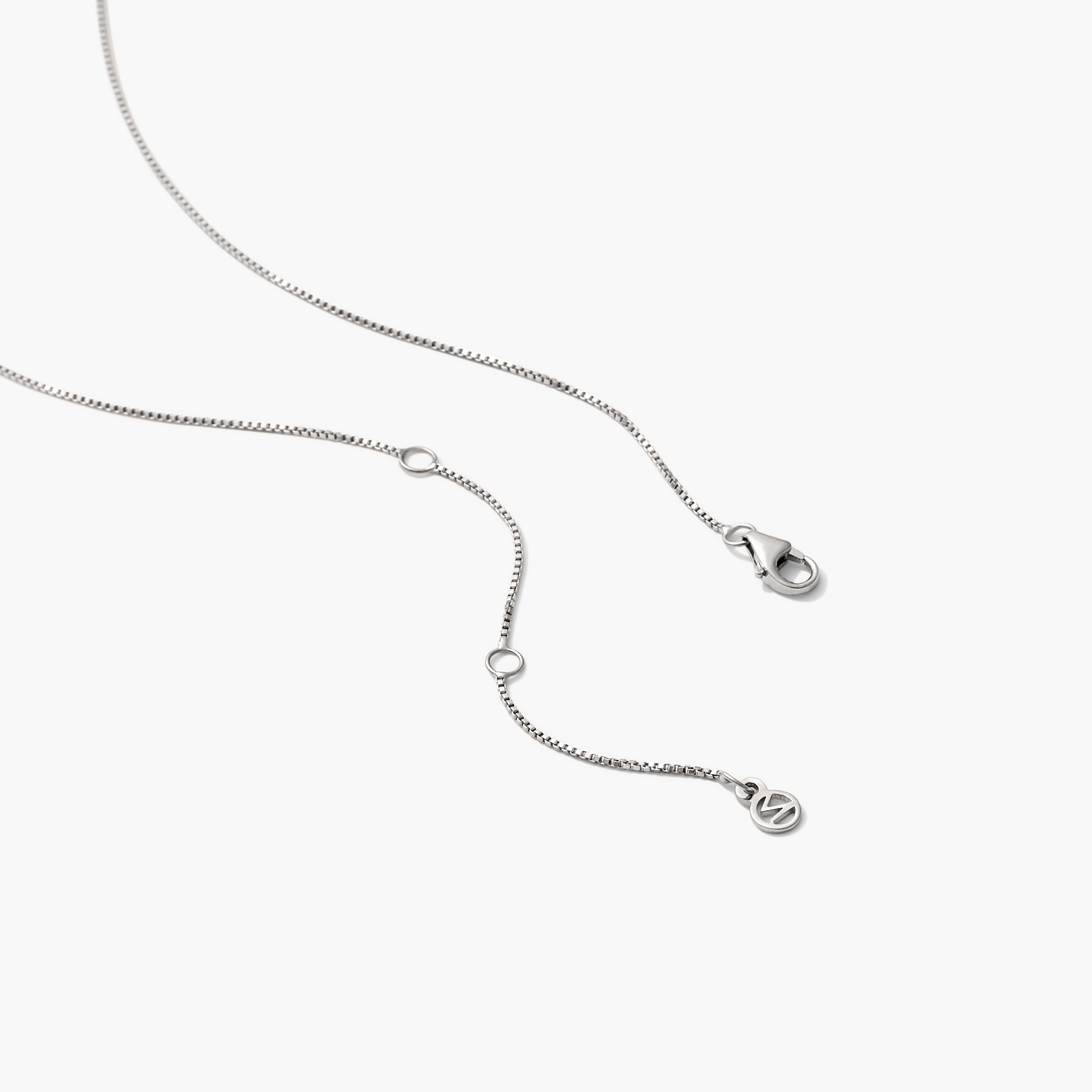 Baby Box Chain Necklace: A delicate, silver box chain with a secure clasp, designed to catch the light beautifully, perfect for adding a touch of elegance.