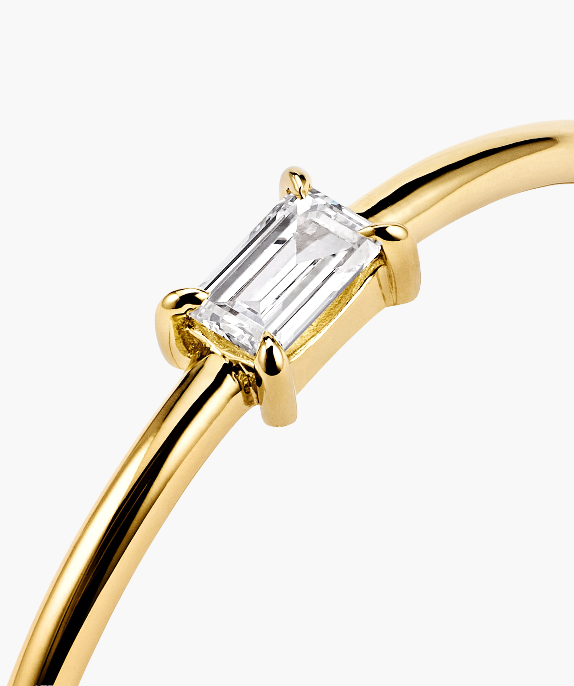 Close-up of a platinum Baguette Stacker Ring, showcasing its sleek metal design and distinctive baguette-shaped details.
