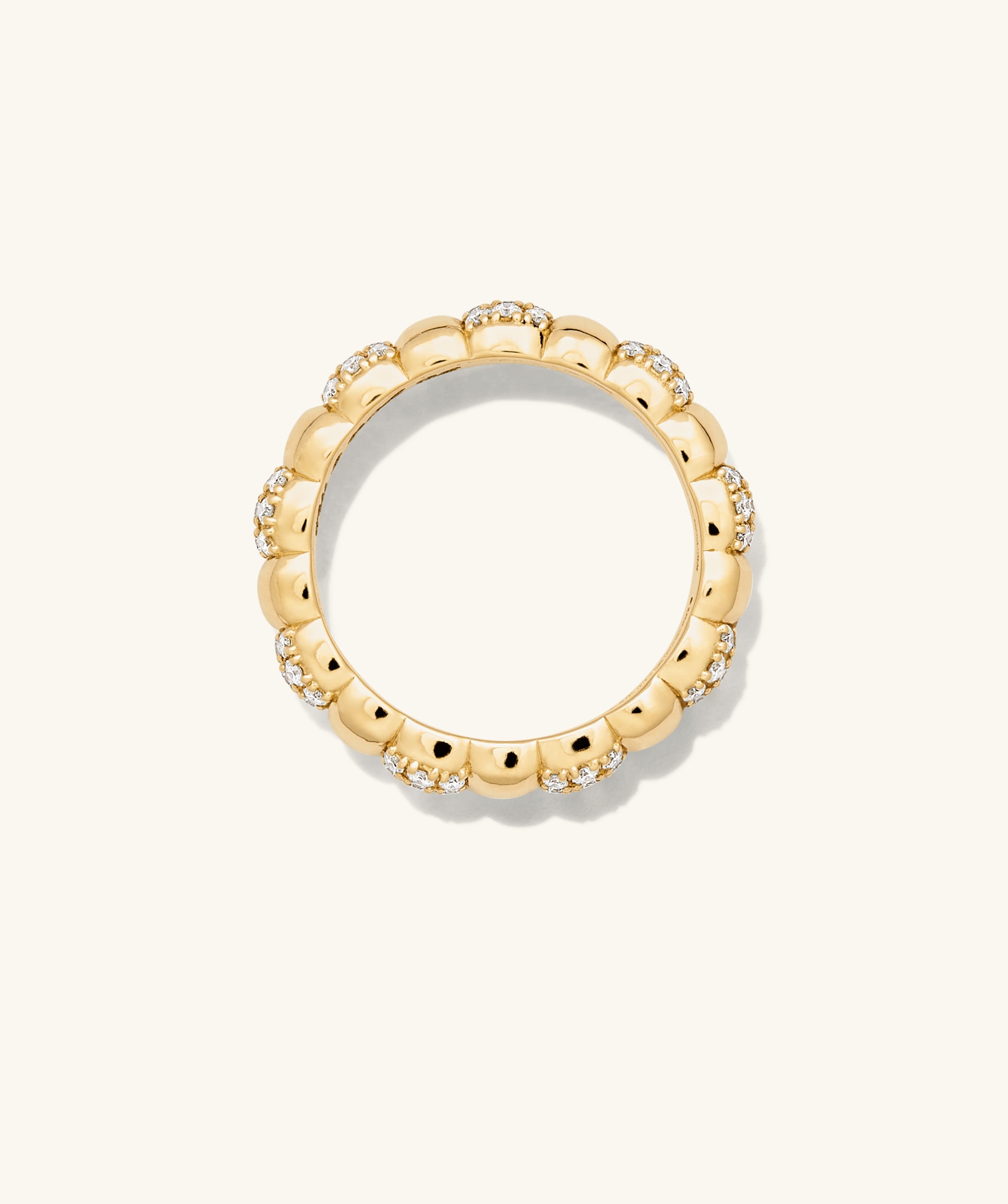 PavÃ© Diamond Soft Charlotte Ring: A 14k gold ring encrusted with 72 pavÃ© diamonds in alternating cushions, totaling 0.55-0.70 carats.