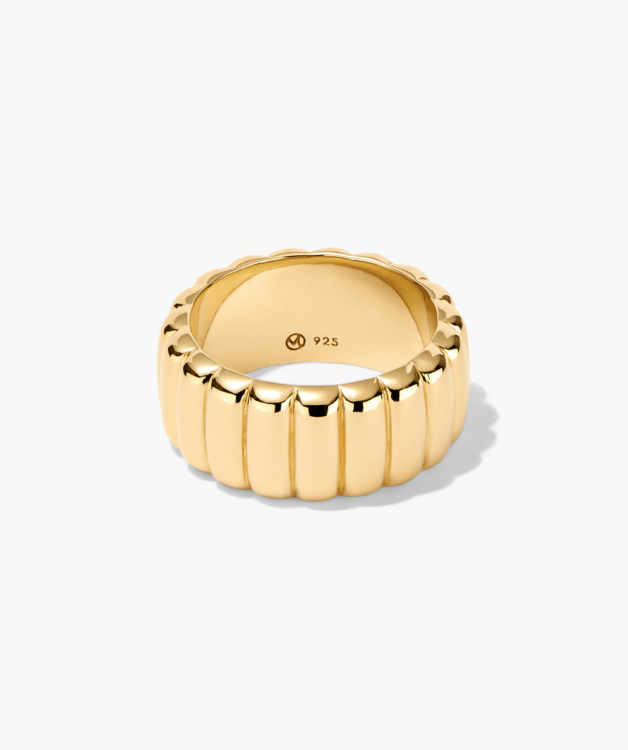 Gold Charlotte Bold Ring with a sleek design and subtle shadow, inspired by French patisserie elegance.