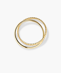 Duo Ring: A pair of handcrafted 14k solid gold rings with thicker bands, designed to twist and complement each other effortlessly.