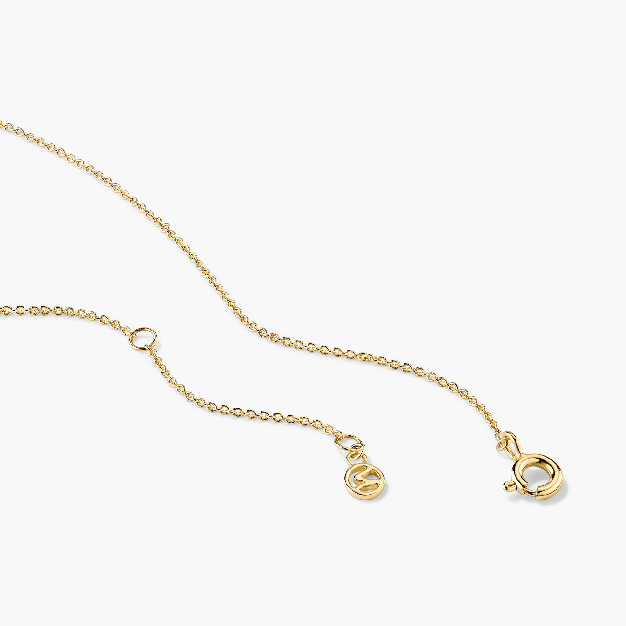 Baguette Gemstone Station Necklace: A stylish gold chain featuring spaced baguette gemstones and a secure clasp, ideal for creating elegant layered looks.