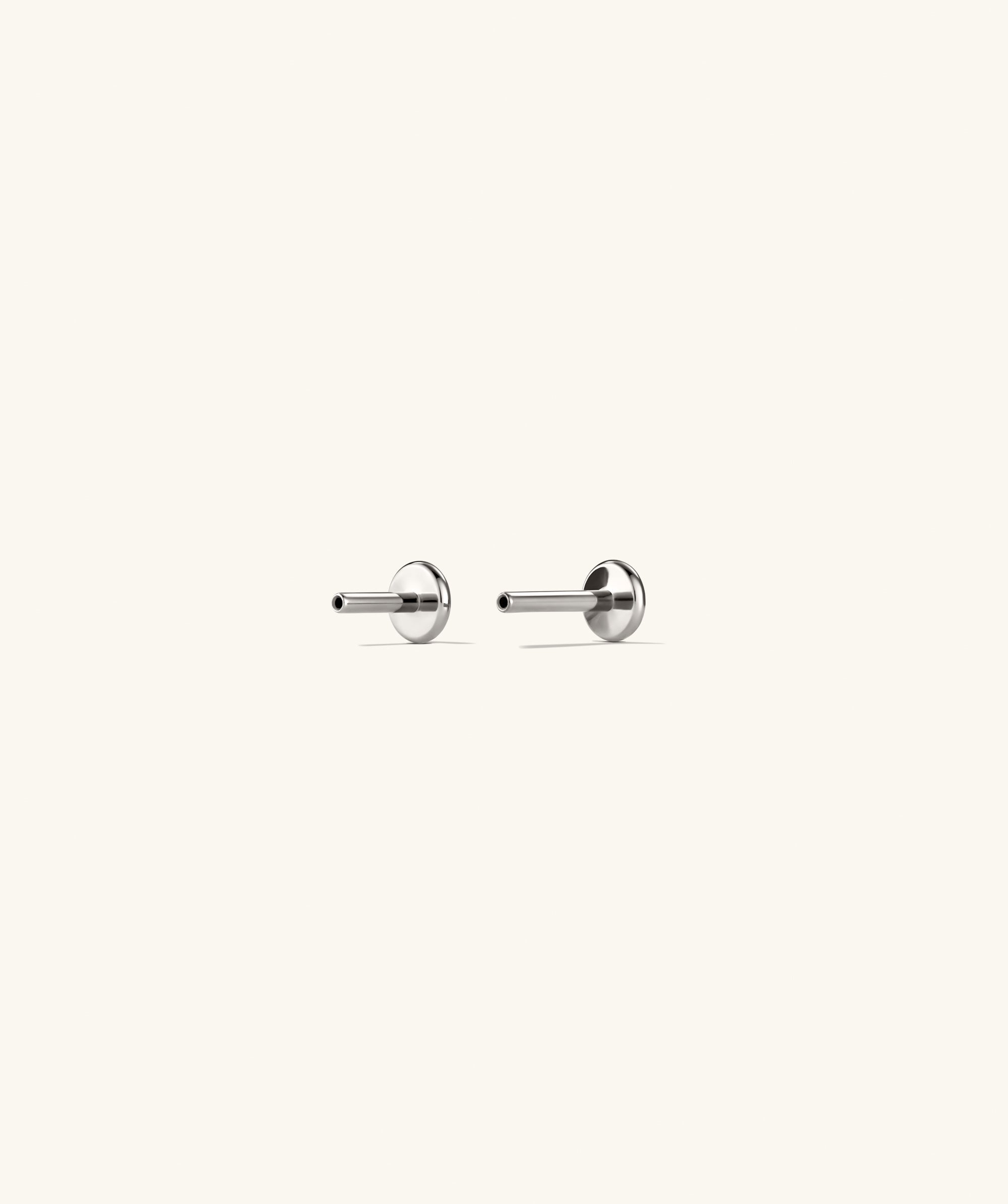 Spheres Bar Stud featuring three spherical elements forming a sleek bar, designed for comfortable stacking with flat back studs for optimal fit.