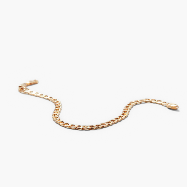 Flat Curb Chain Bracelet displayed on a neutral background, showcasing its sleek, continuous gold design that effortlessly complements any look.
