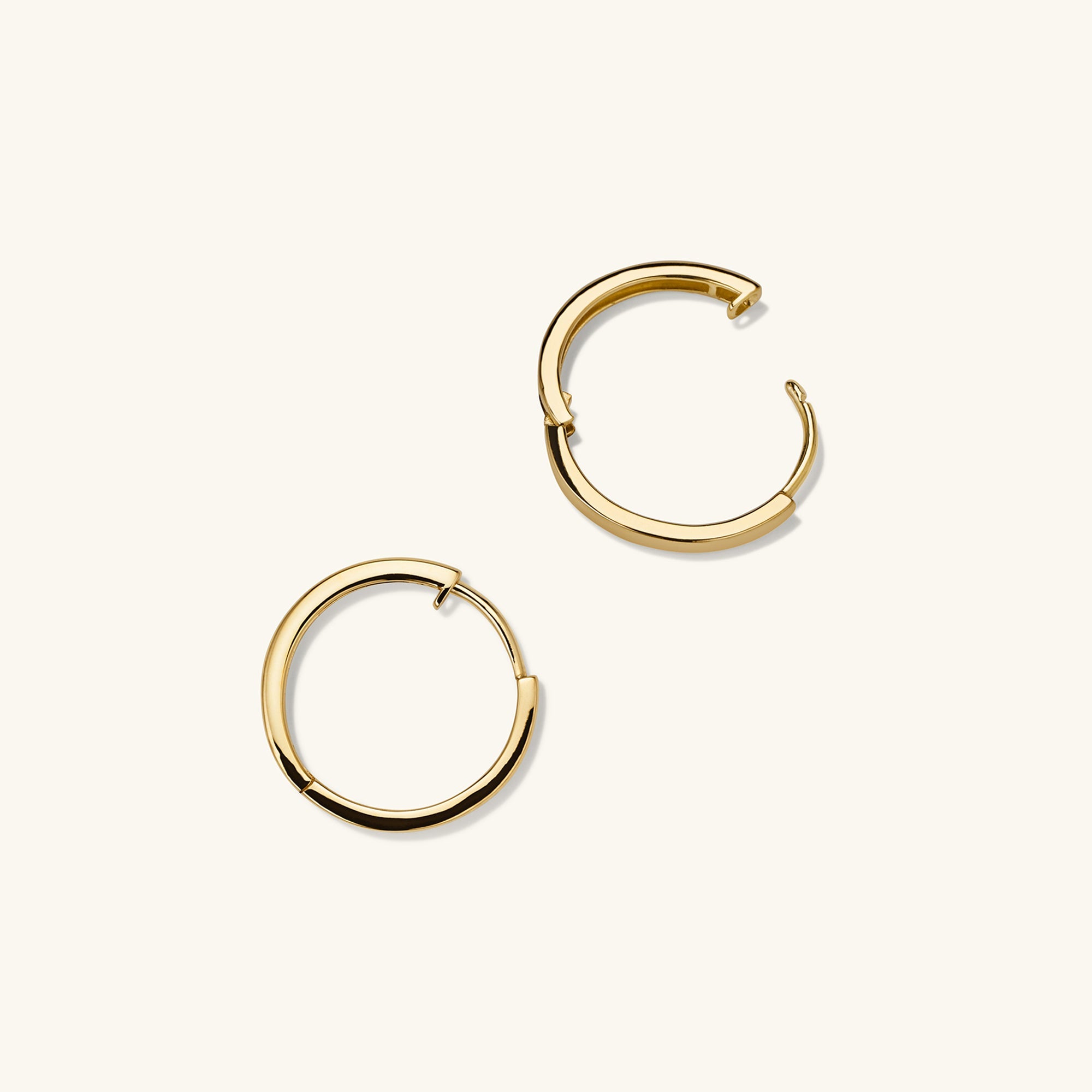 Easy Small Hoops: A pair of handcrafted 14k gold hoop earrings with a clicker closure, designed for everyday comfort and effortless style.