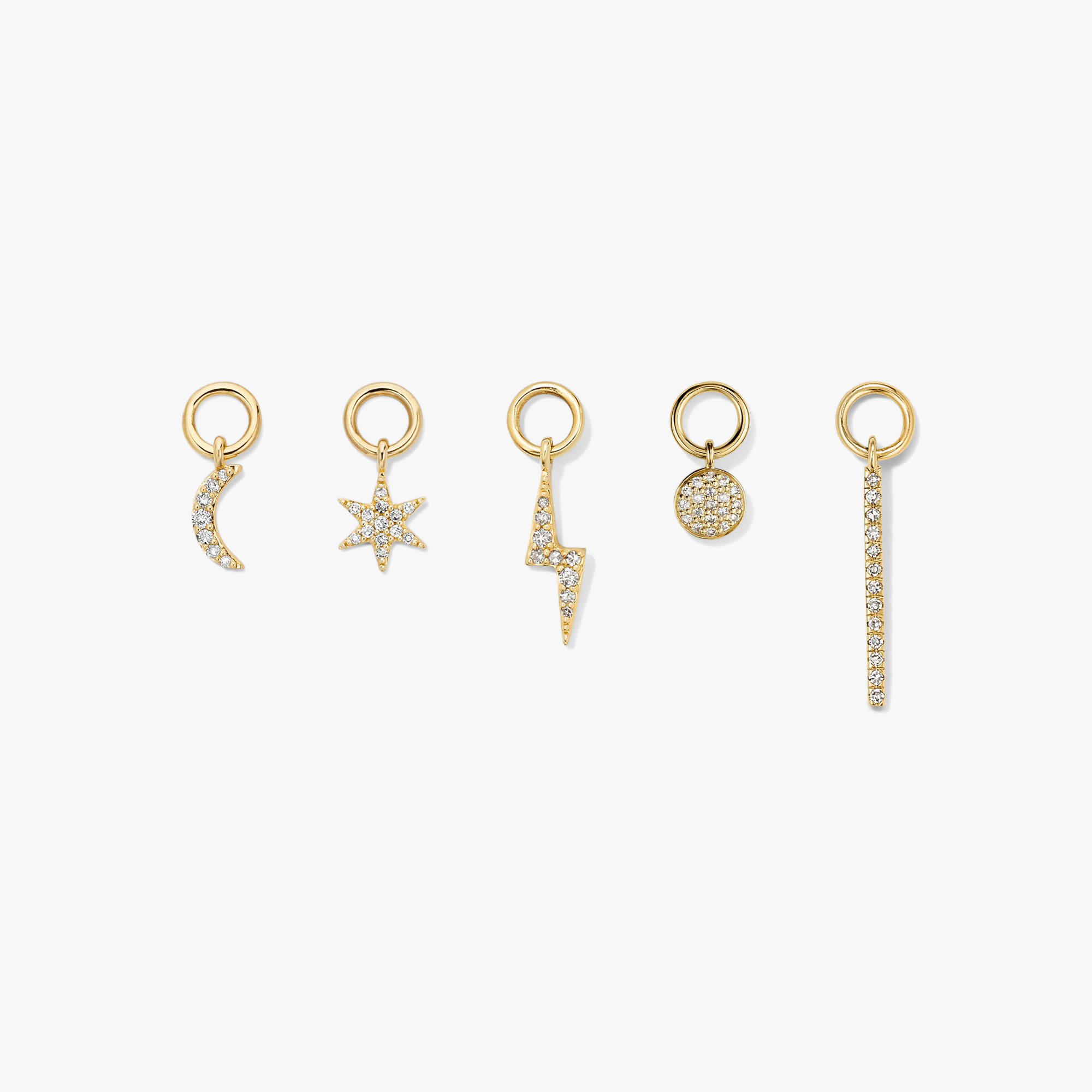 Single PavÃ© Diamond Star Hoop Charm displayed among other gold jewelry, showcasing a gold star adorned with diamonds designed to enhance and personalize hoop earrings.