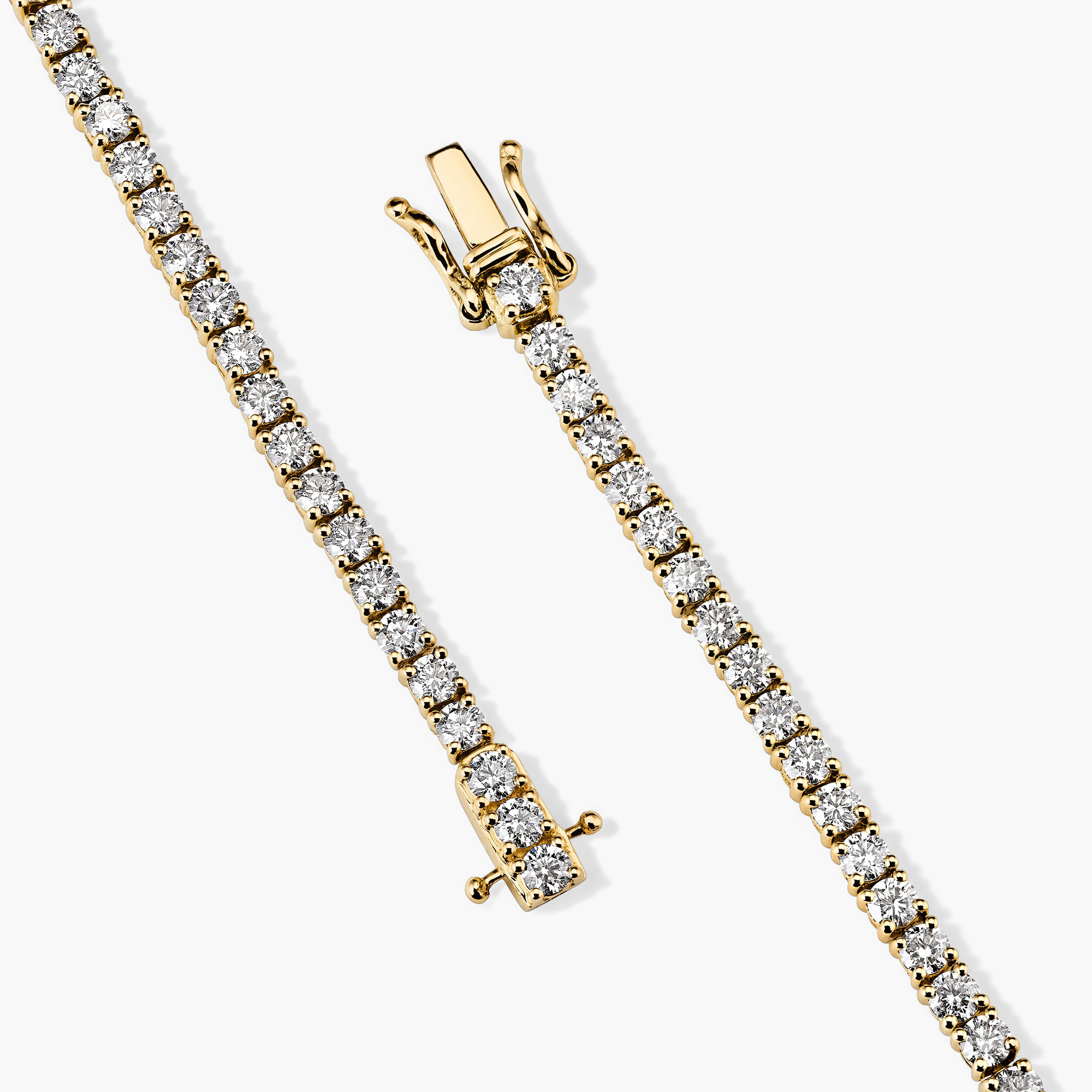 Lab Grown Diamond Tennis Bracelet 2.5mm: A handcrafted 14k gold bracelet adorned with lab grown diamonds, featuring a secure clasp with safety arms.